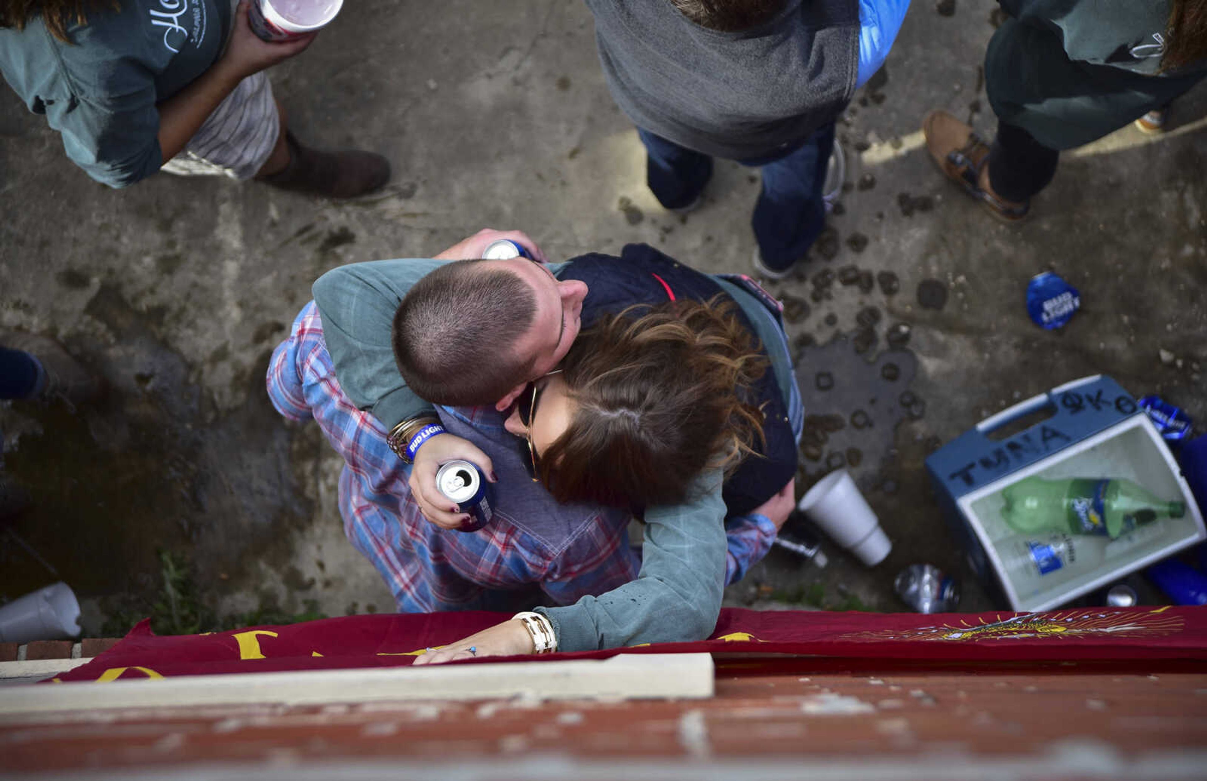 ANDREW J. WHITAKER ~ awhitaker@semissourian.com
Tailgaters hug out side The Last Call during Southeast Missouri State University homecoming Saturday, Nov. 5, 2016 in Cape Girardeau.