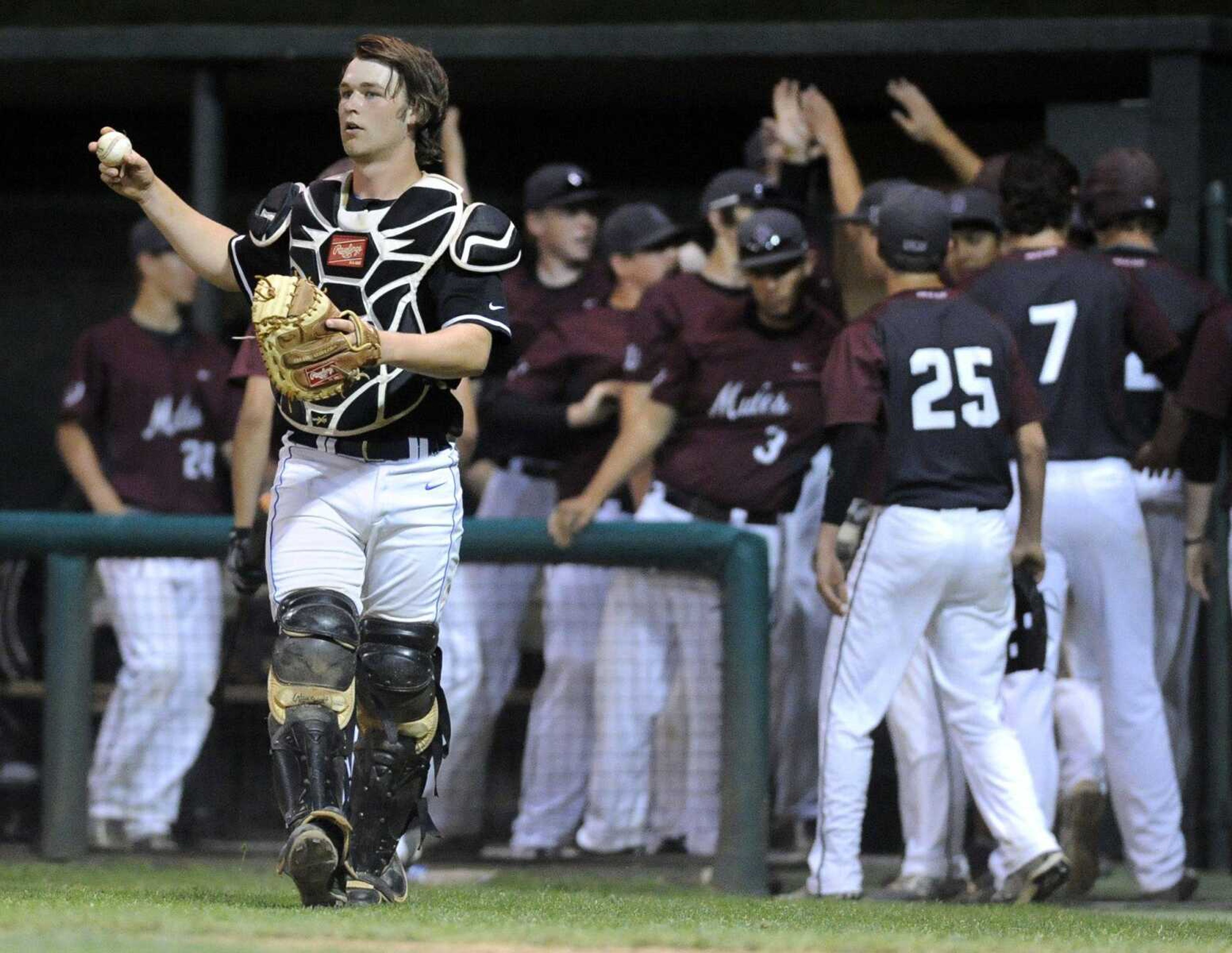 Notre Dame catcher Christian Job retrieves the ball after a score by Poplar Bluff's Brandon Stuckenschneider in the sixth inning that tied the championship game of the SEMO Conference Tournament Monday, May 4, 2015 at Capaha Field. (Fred Lynch)