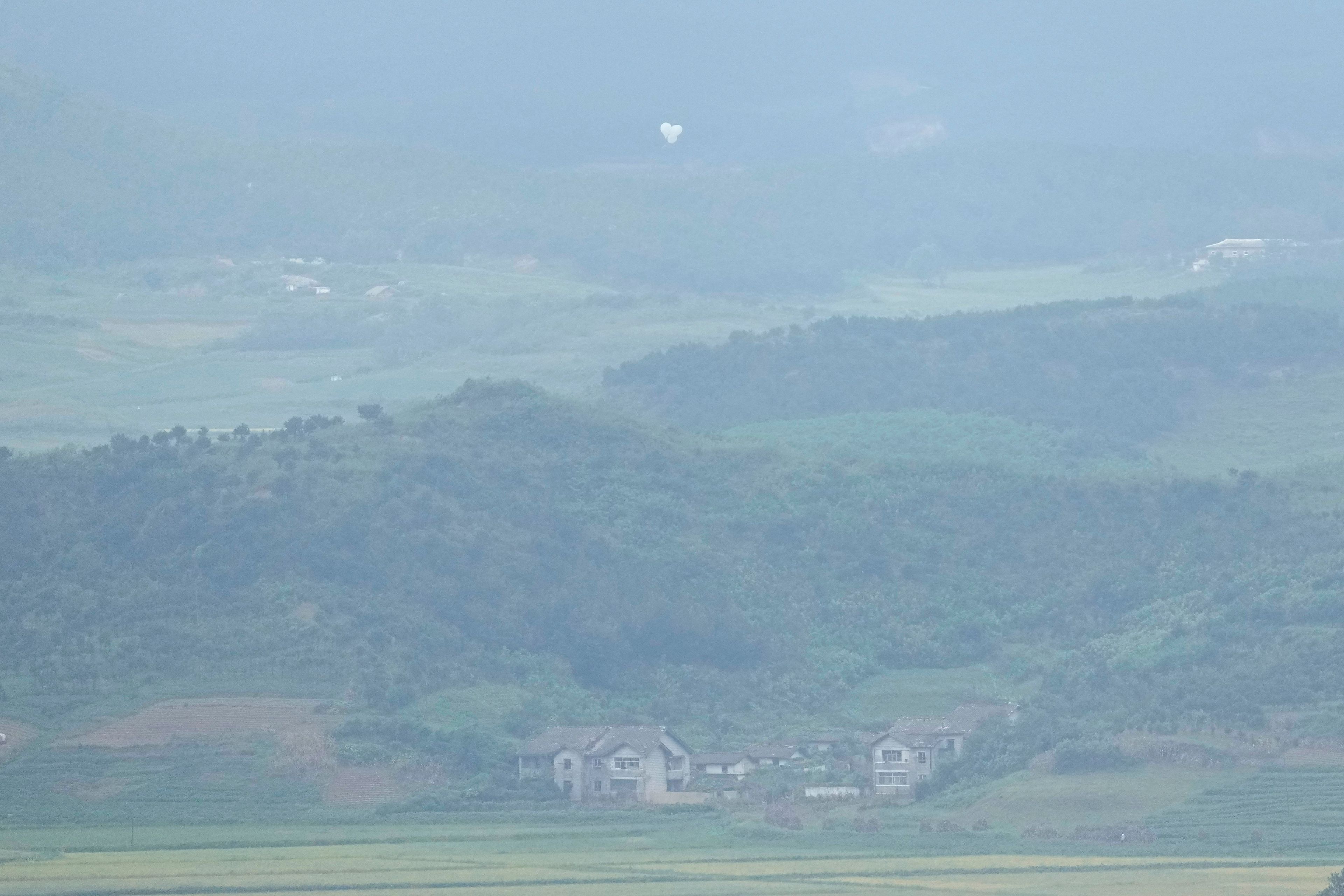 Balloons are seen from the Unification Observation Post in Paju, South Korea, near the border with North Korea, Thursday, Sept. 5, 2024. (AP Photo/Lee Jin-man)