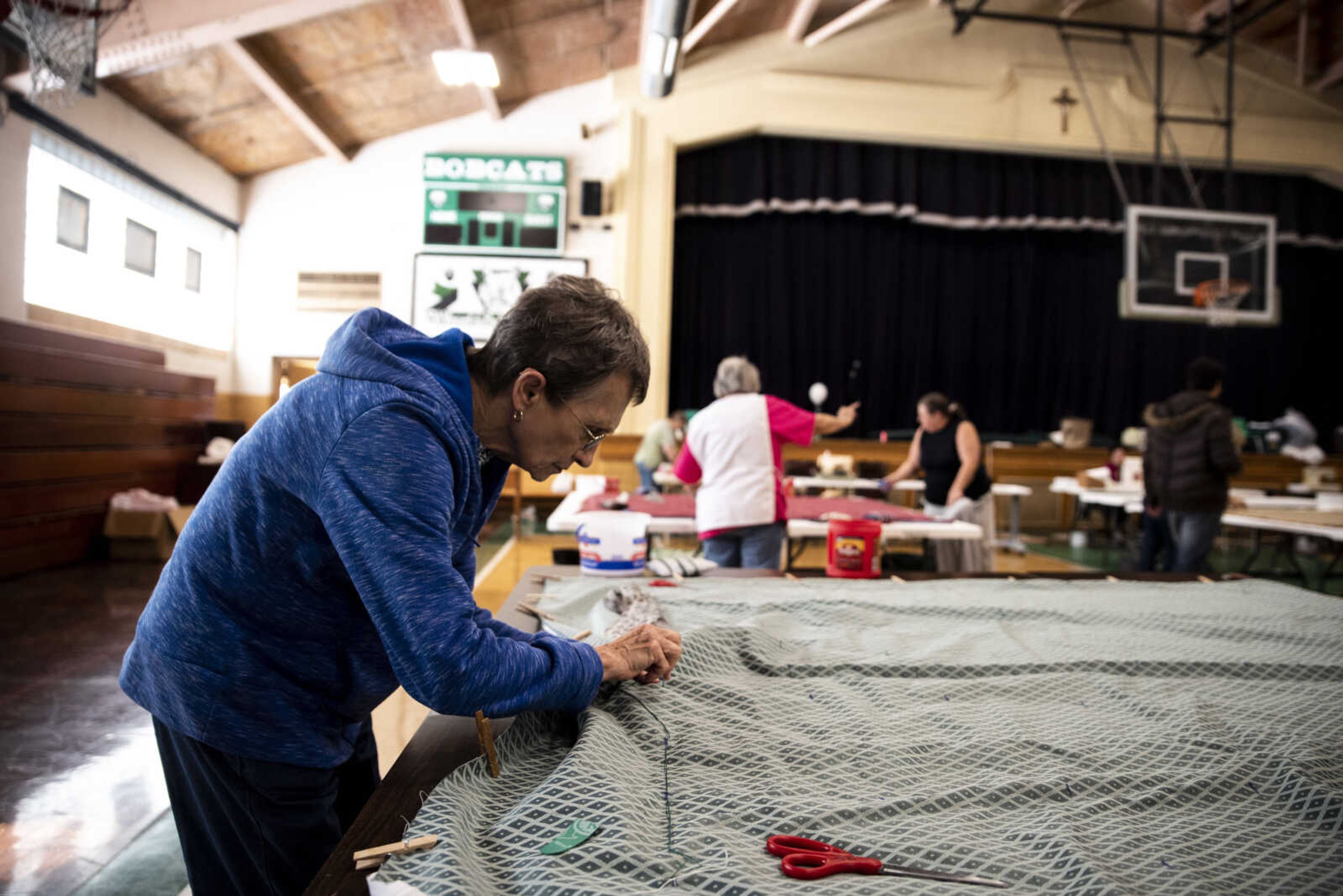 Judy Roth tacks a quilt during the Ugly Quilt Weekend at St. Vincent de Paul Parish Sunday, Oct. 28, 2018, in Cape Girardeau.