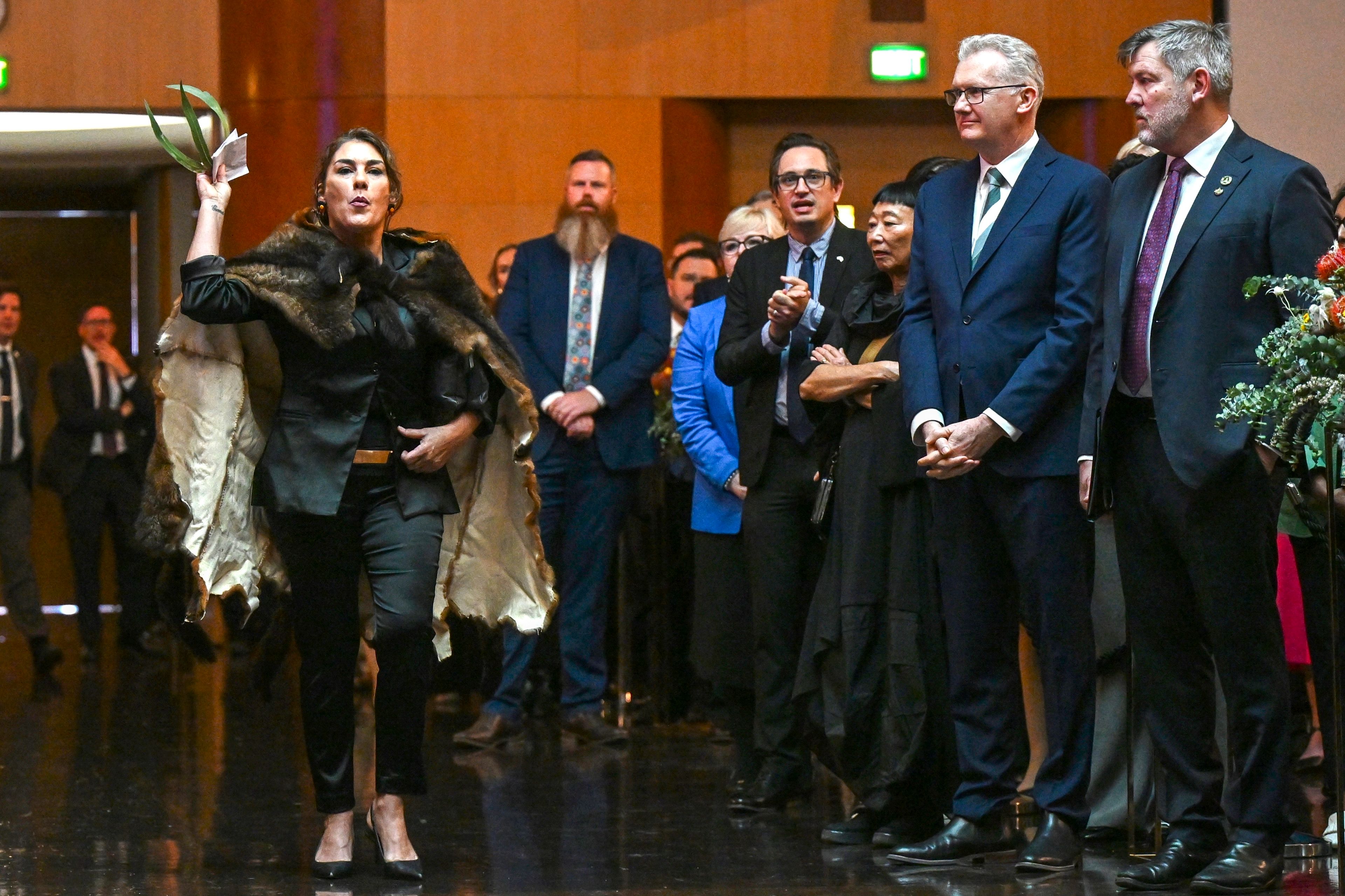 Australian Senator Lidia Thorpe, left, disrupts proceedings as Britain's King Charles and Queen Camilla attend a Parliamentary reception hosted by Australian Prime Minister Anthony Albanese and partner Jodie Jaydon at Parliament House in Canberra, Australia, Monday, Oct. 21, 2024. (Lukas Coch/Pool Photo via AP)