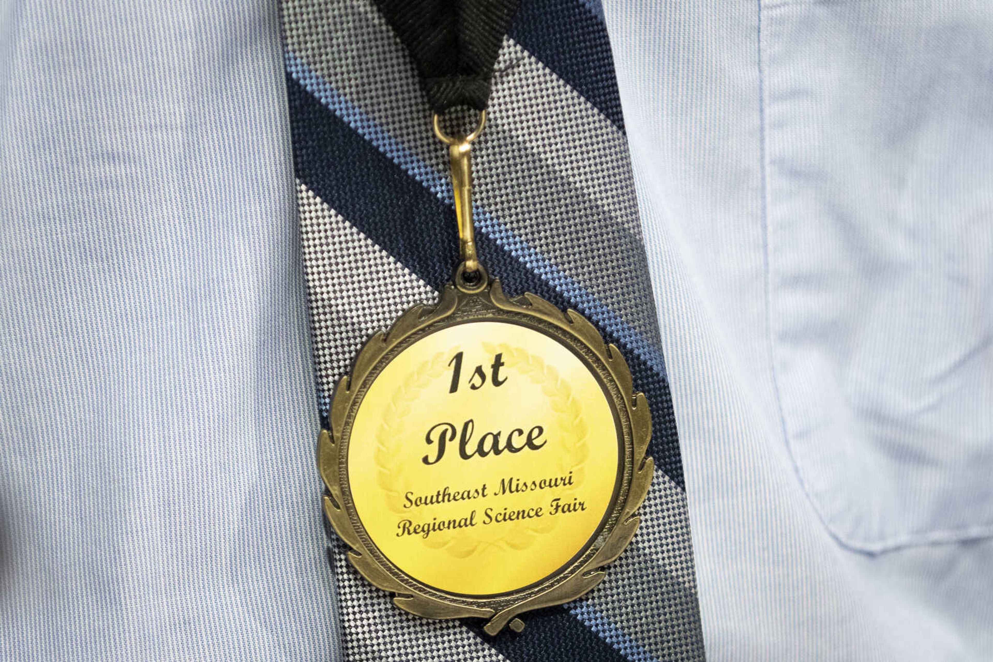 A first place medal around the neck of Grant Roseman of Jackson, 15, during the 63rd annual Southeast Missouri Regional Science Fair on Tuesday, March 5, 2019, at the Show Me Center in Cape Girardeau.