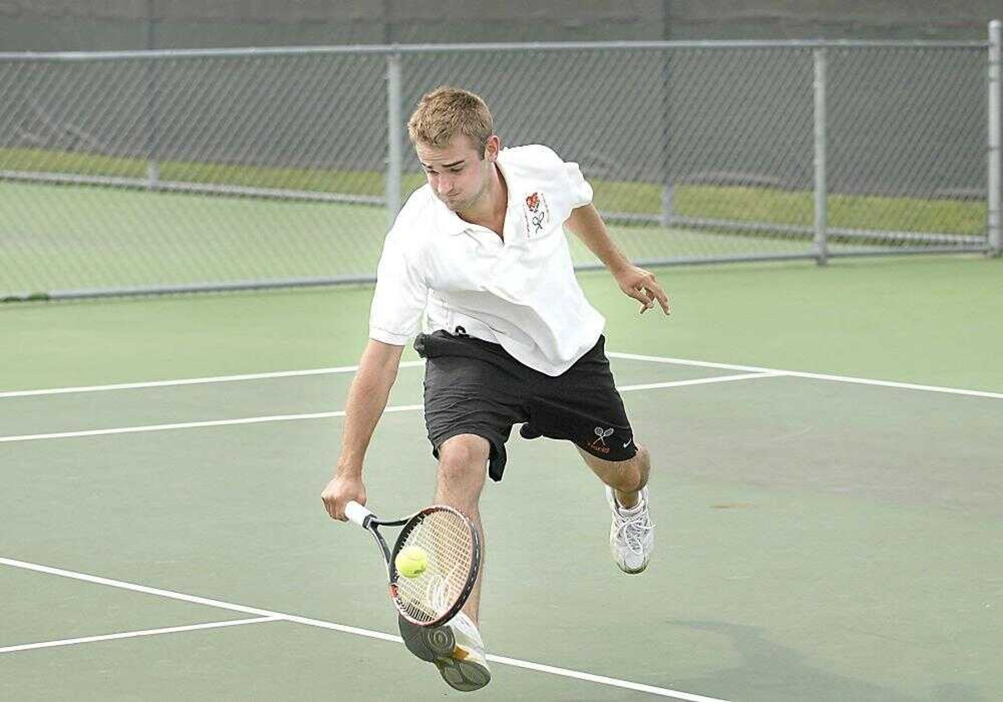 Central's Rob Weir lunged for a short shot during doubles play with Will LaFoe against Eureka oin Tuesday at Central High. The Tigers rolled to a 6-0 victory. (Kit Doyle)