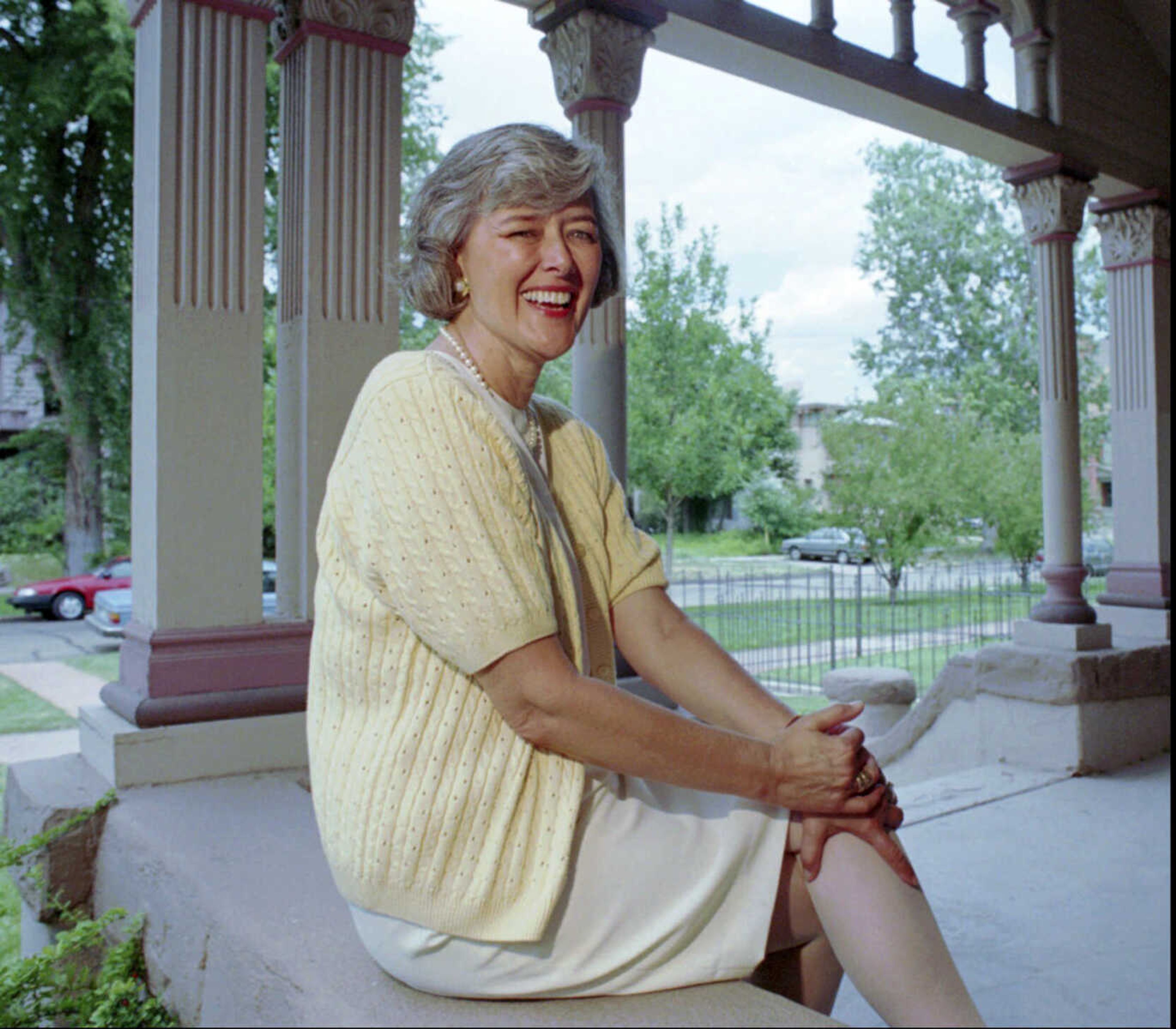 FILE - U.S. Rep. Pat Schroeder, D-Colo., sits on the porch outside her Capitol Hill headquarters in Denver on July 18, 1994. Schroeder, a pioneer for women's and family rights in Congress, has died at the age of 82. Schroeder's former press secretary, Andrea Camp, said Schroeder suffered a stroke recently and died Monday night, March 13, 2023, at a hospital in Florida, the state where she had been residing.  (AP Photo/file/Joe Mahoney, File)