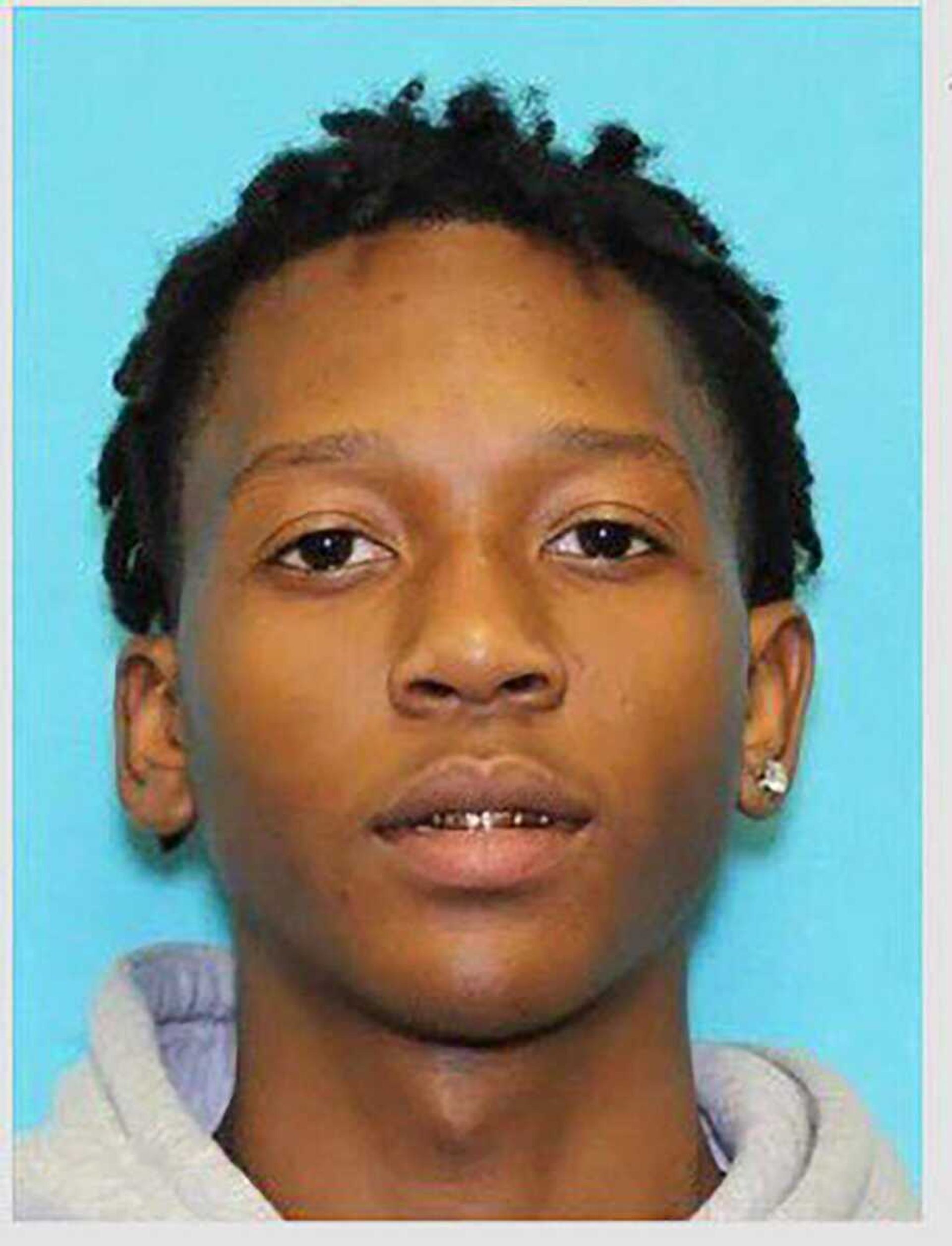 This undated photo provided by the Arlington Police Department in Arlington, Texas shows Timothy George Simpkins. Police are searching for Simpkins, who is the suspected shooter at a Dallas-area high school, leaving four people injured before fleeing, authorities said Wednesday, Oct. 6, 2021. 