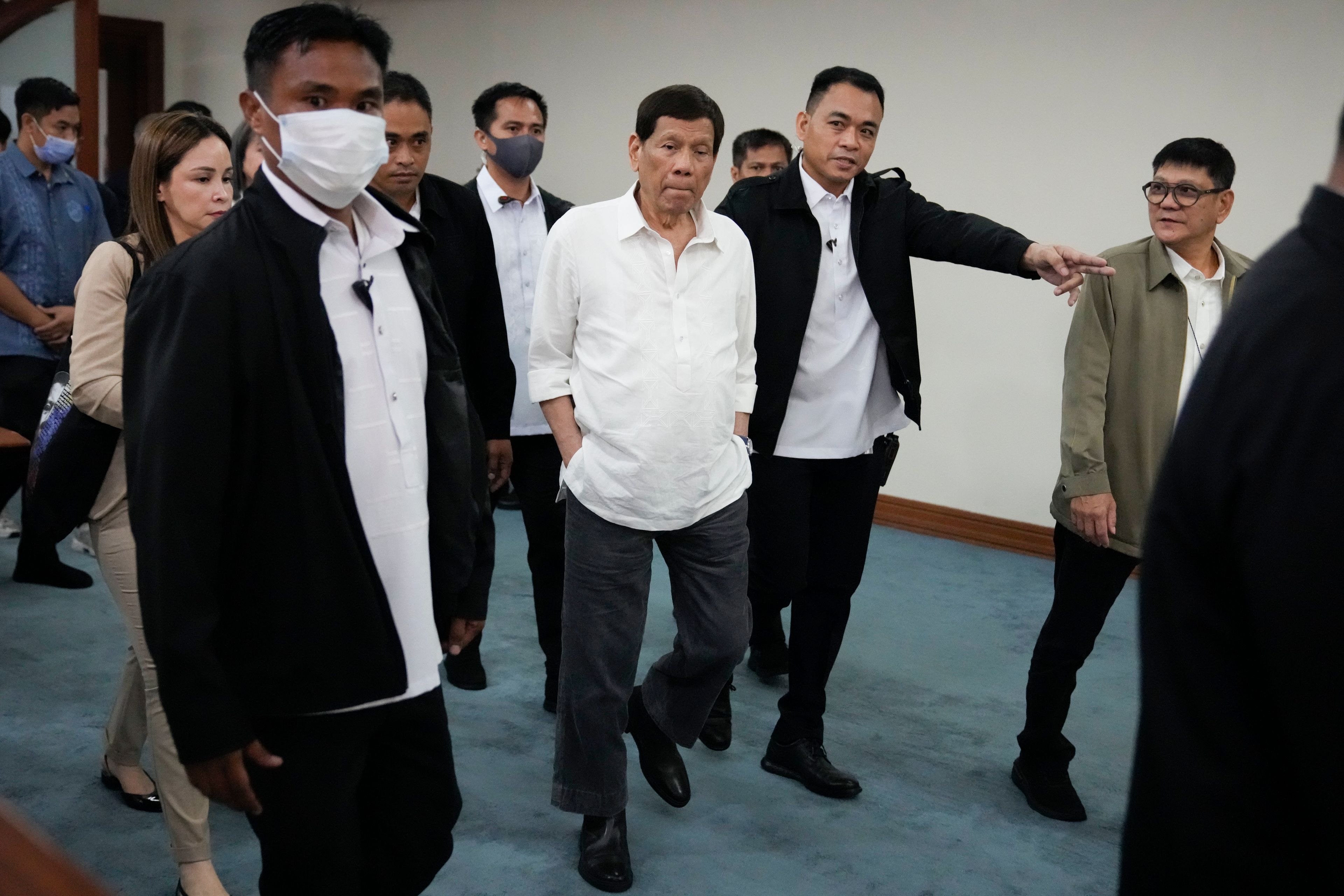 Former Philippine President Rodrigo Duterte walks during a senate investigation on the war on the drugs during his administration, at the Philippine Senate, Monday, Oct. 28, 2024, in Manila, Philippines. (AP Photo/Aaron Favila)