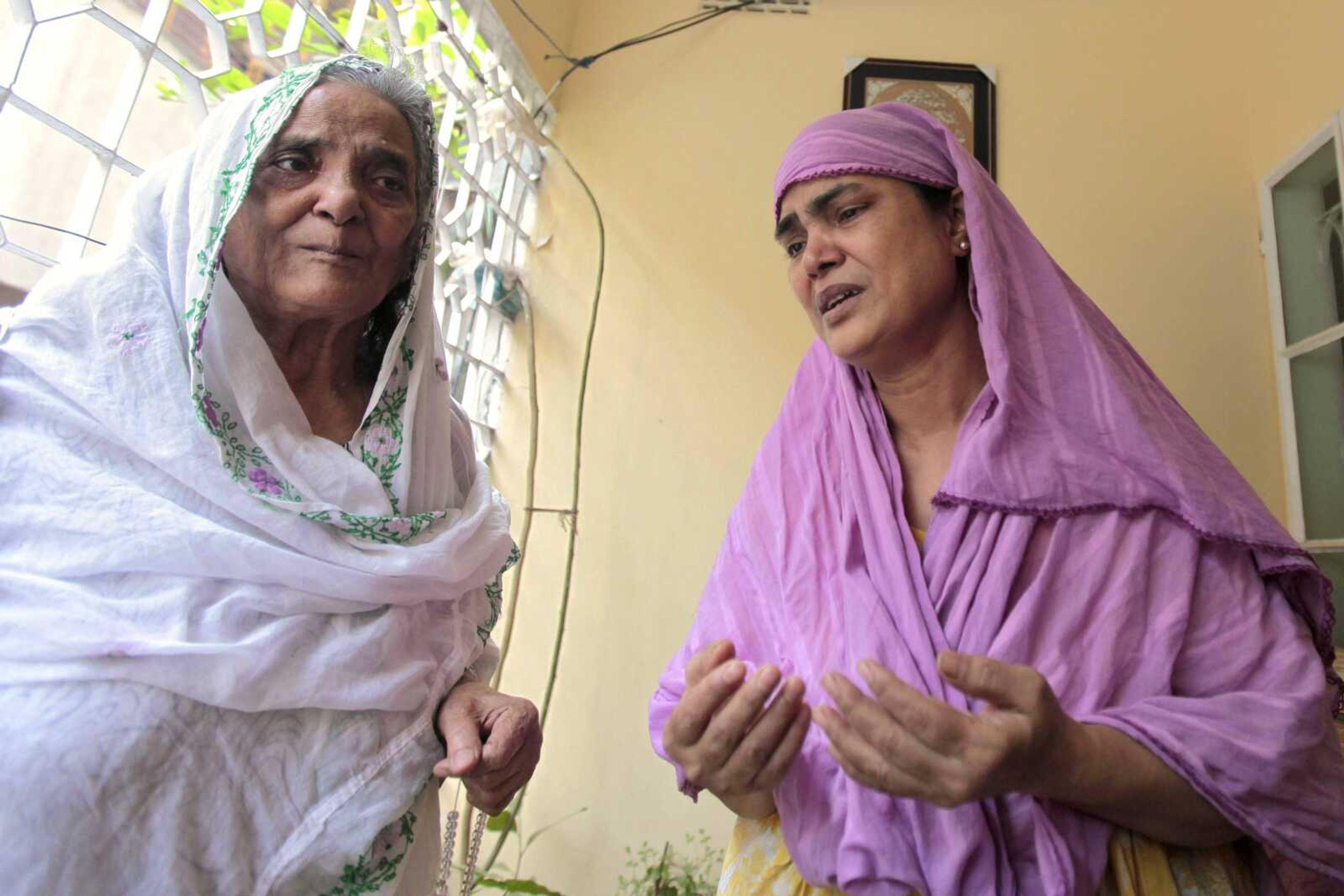 Grandmother, left, and aunt of Bangladeshi Quazi Mohammad Rezwanul Ahsan Nafis weep in his home in the Jatrabari neighborhood in north Dhaka, Bangladesh on Thursday. The FBI arrested 21-year-old Nafis on Wednesday after he tried to detonate a fake car bomb, according to a criminal complaint. (A.M. Ahad ~ Associated Press)