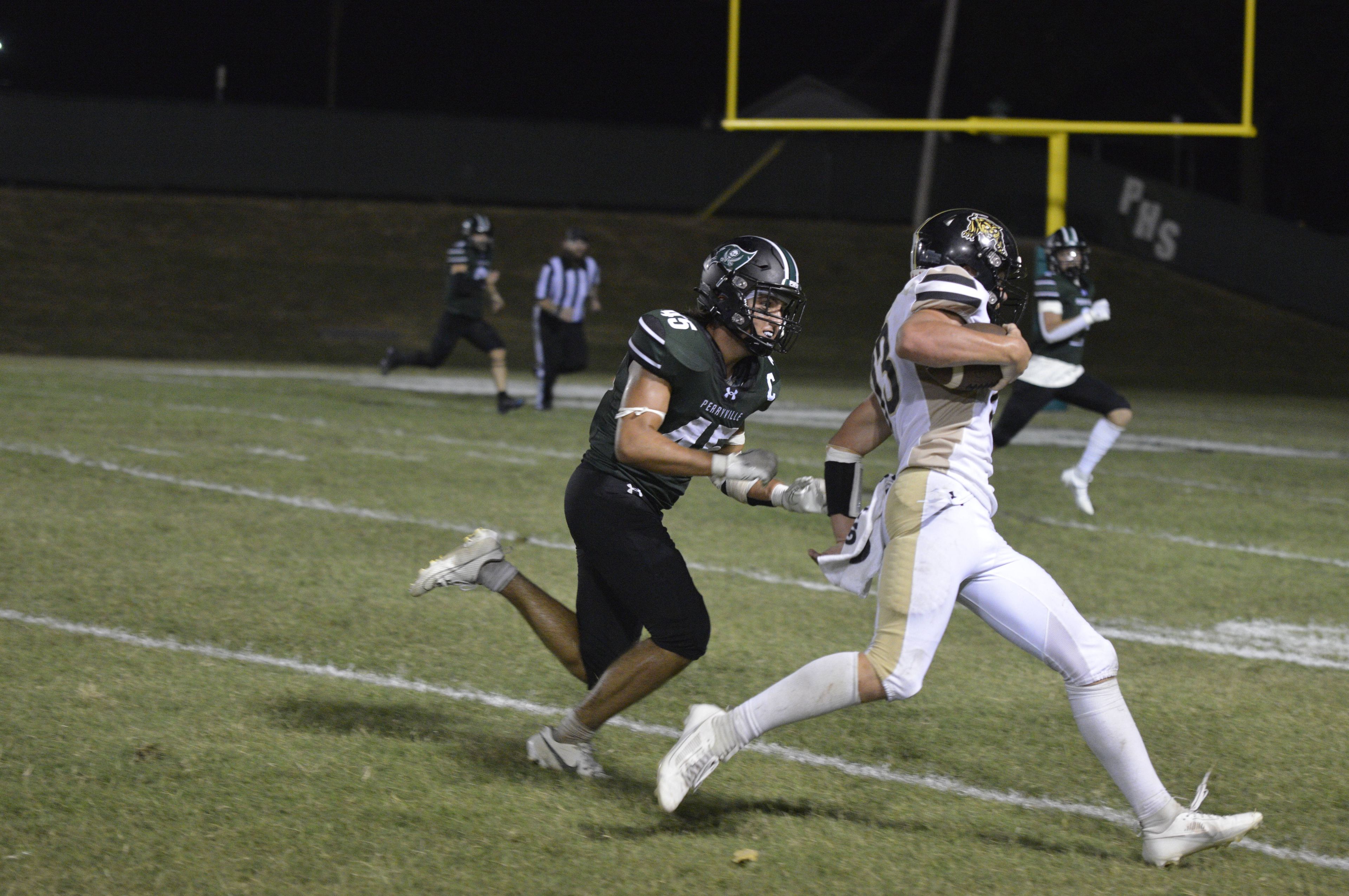 Perryville linebacker Wyatt Schremp chases down Fredericktown quarterback Easton Wood on Thursday, Aug. 29, in Perryville, Mo.