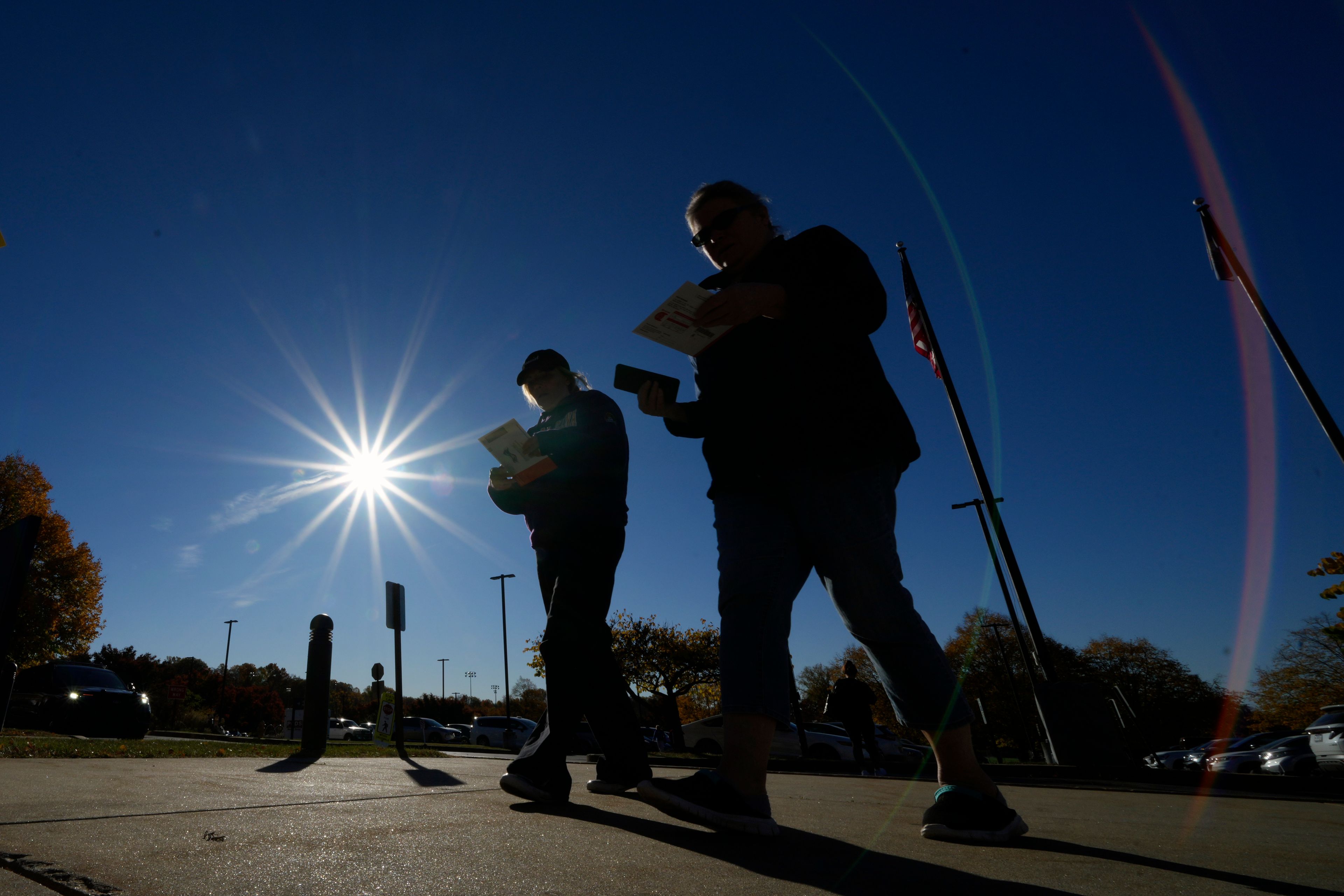 Voters return their mail-in ballots for the 2024 General Election in the United States outside the Chester County Government Services Center, Friday, Oct. 25, 2024, in West Chester, Pa. (AP Photo/Matt Slocum)