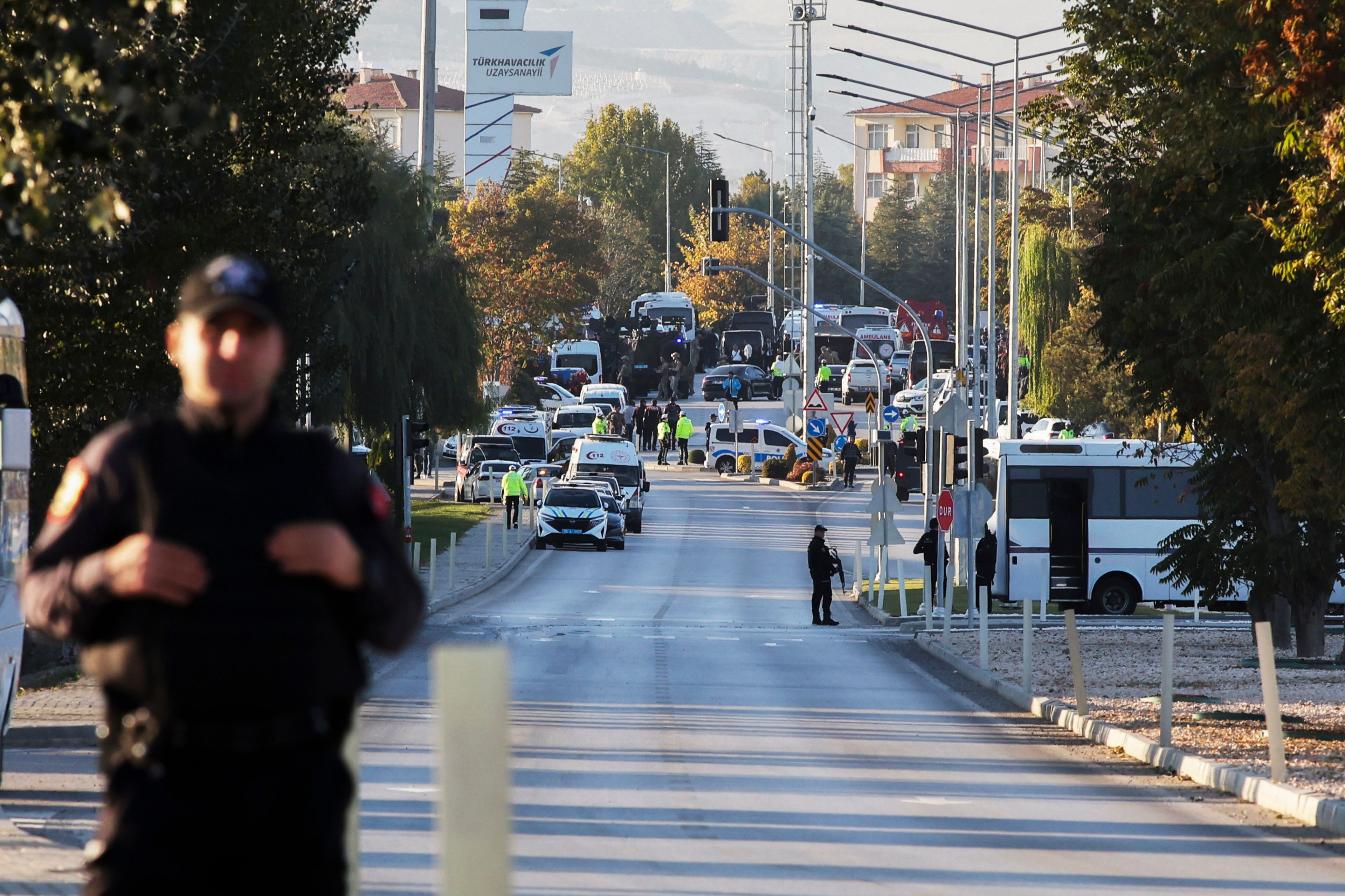 Emergency and security teams are deployed outside Turkish Aerospace Industries Inc. at the outskirts of Ankara, Turkey, Wednesday, Oct. 23, 2024. (Yavuz Ozden/Dia Photo via AP)