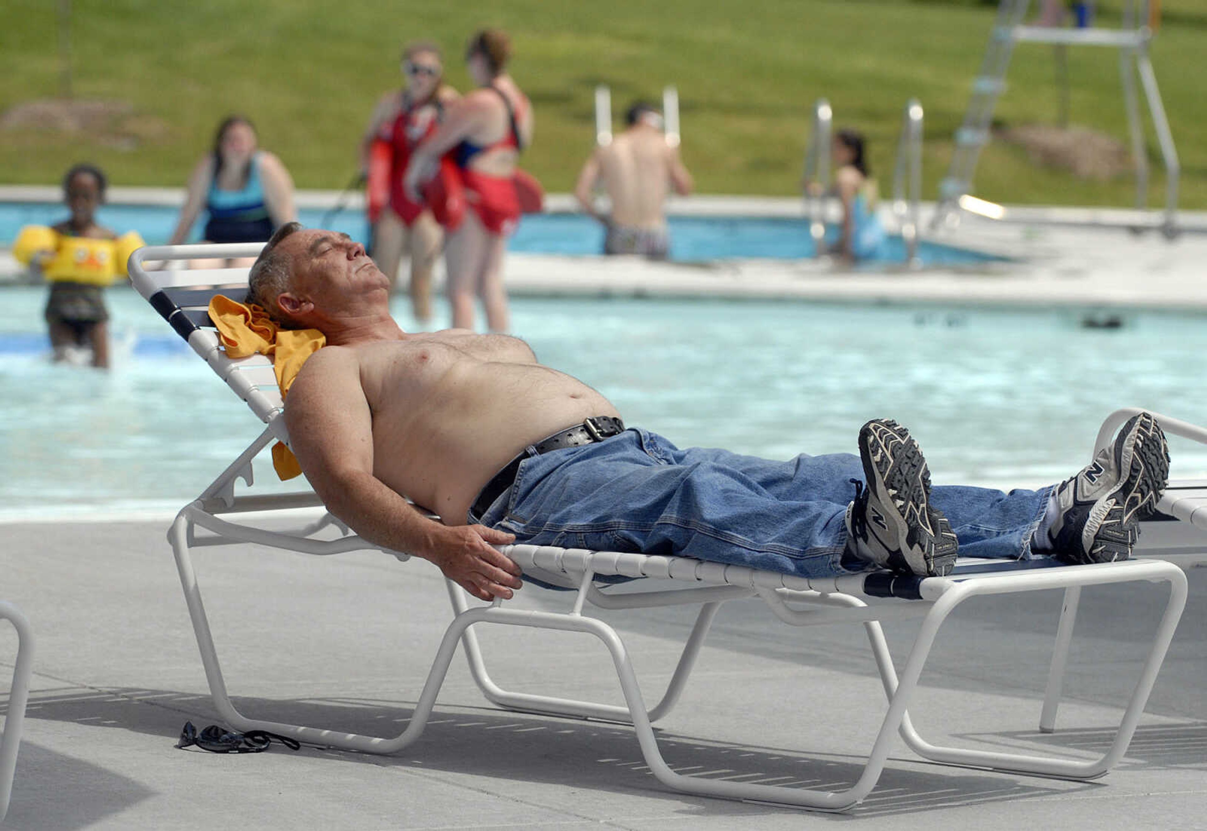 LAURA SIMON~lsimon@semissourian.com
David Johnson of Zalma, Mo. sunbathes Saturday, May 28, 2011 during opening day of Cape Splash Family Aquatic Center in Cape Girardeau.