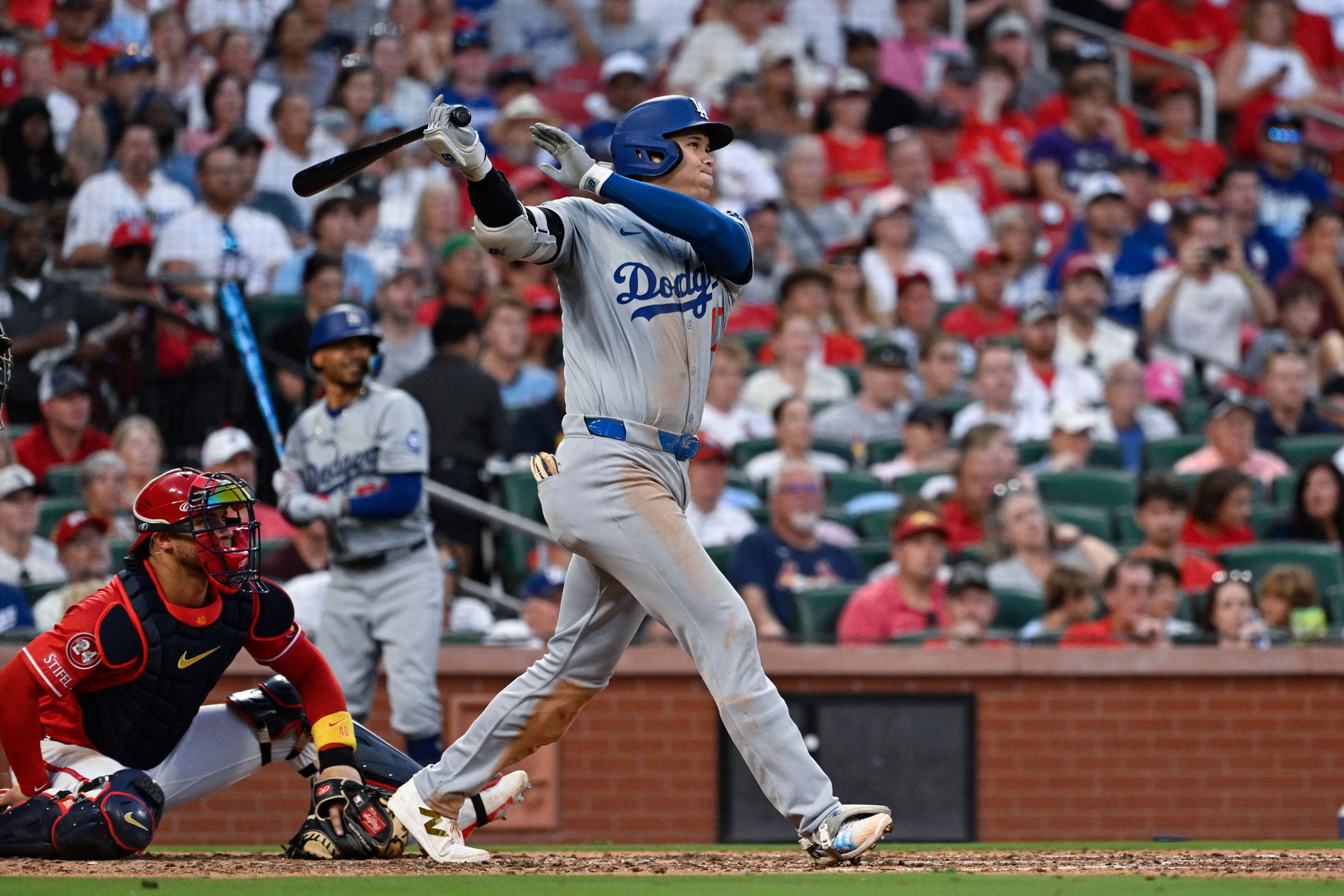 Los Angeles Dodgers' Shohei Ohtani follows through on a home run against the St. Louis Cardinals during the fifth inning of a baseball game Saturday, Aug. 17, 2024, in St. Louis. (AP Photo/Jeff Le)