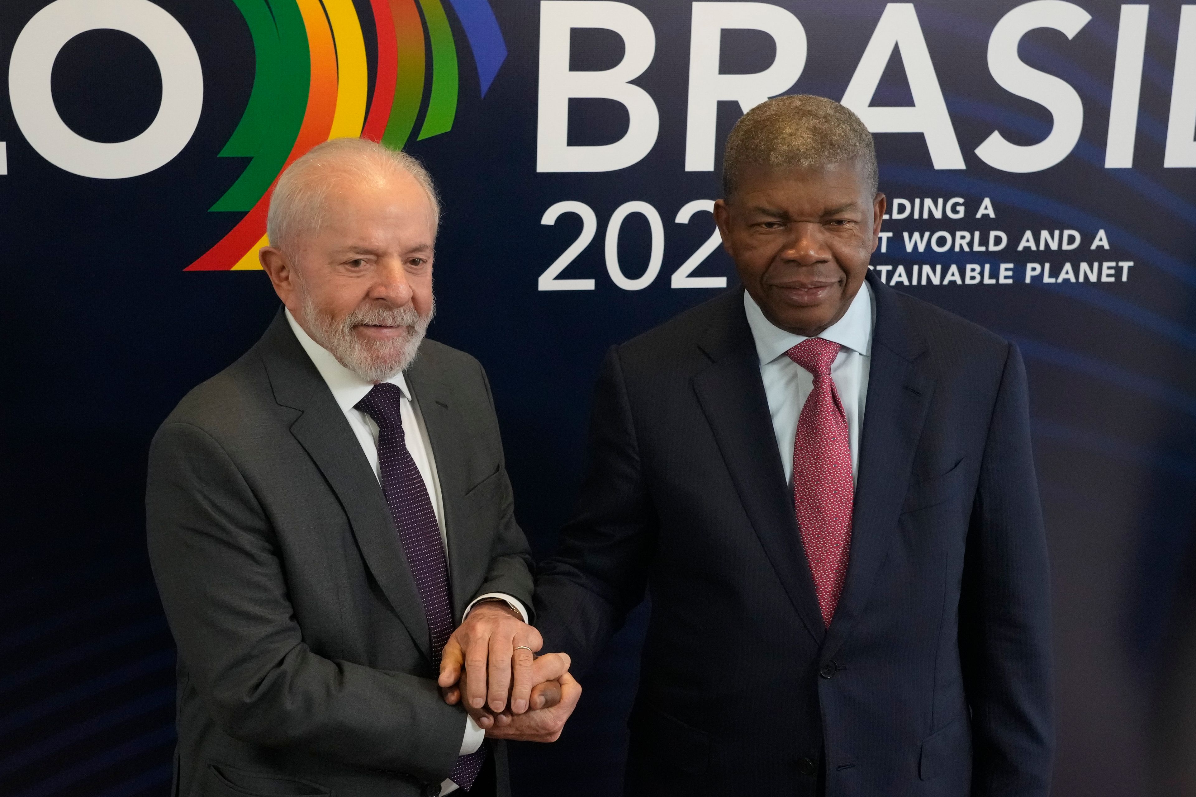 Brazil's President Luiz Inacio Lula da Silva, left, poses for photos with Angola's President Joao Manuel Goncalves Lourenco, during a bilateral meeting a day before the opening of the G20 Summit, in Rio de Janeiro, Sunday, Nov. 17, 2024. (AP Photo/Eraldo Peres)