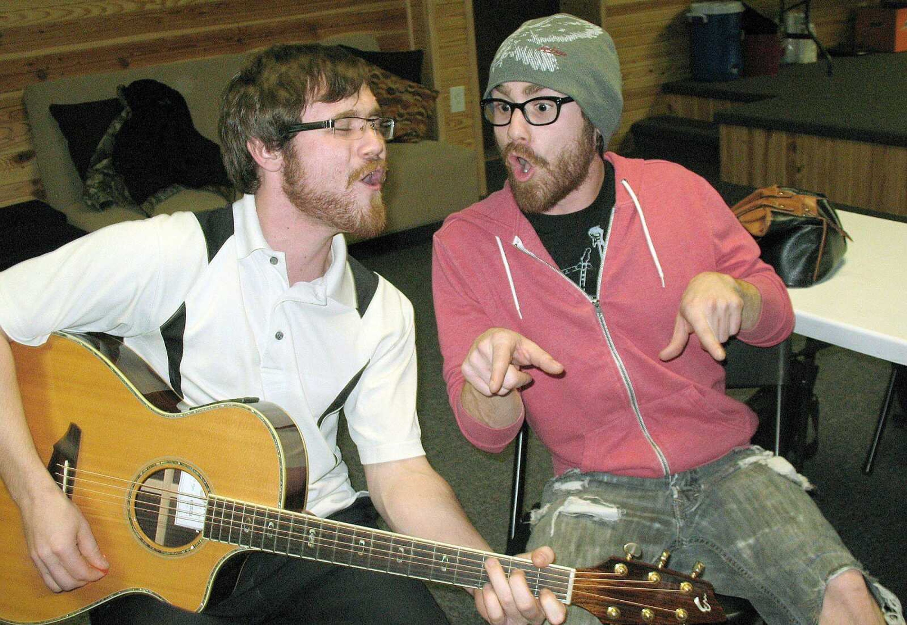 Pop star Usher chose the brothers act of Clinton, left, and Coty Walker of Bernie, Mo., on his team for NBC's "The Voice" competition. (Courtesy)