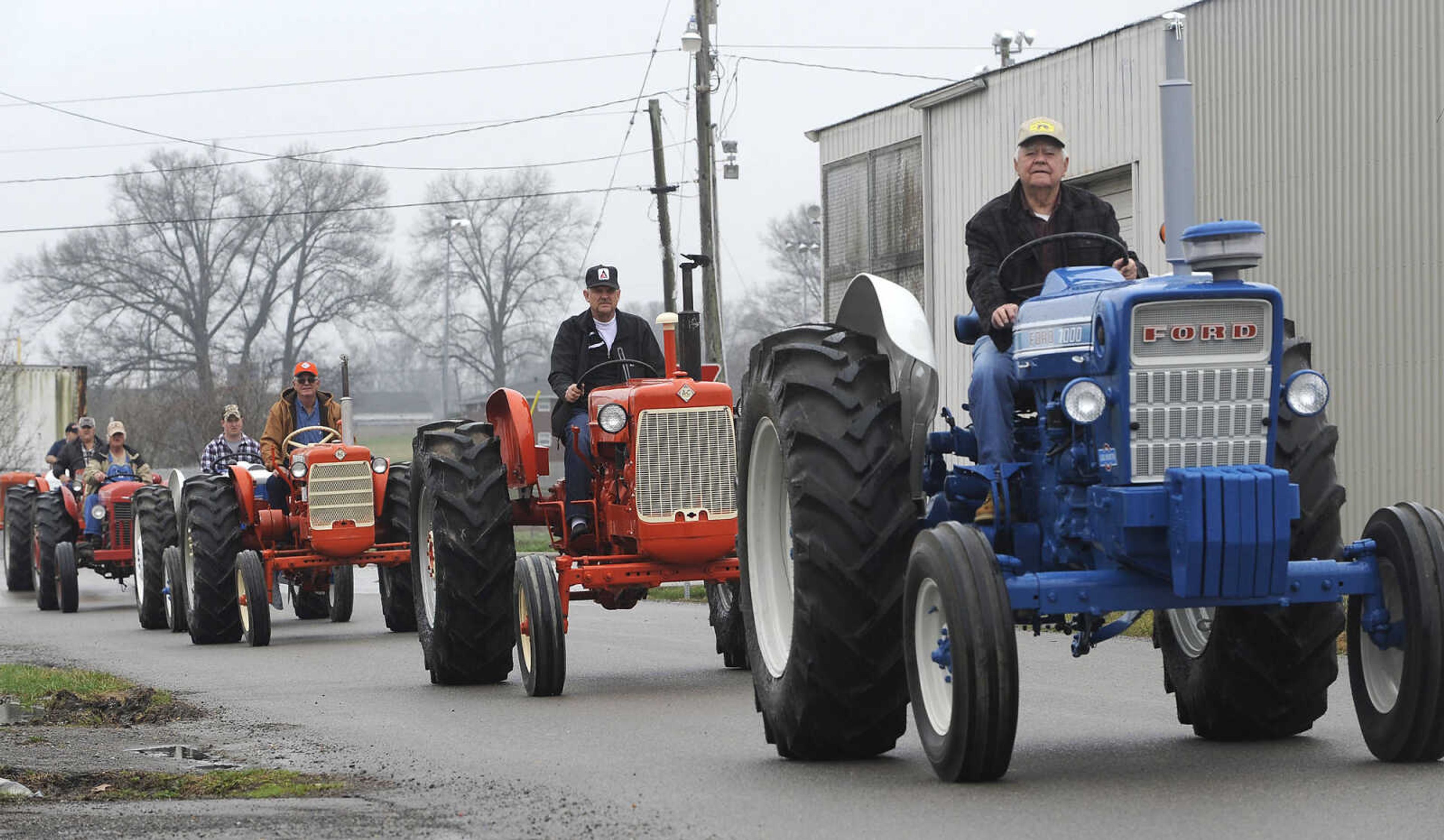 FRED LYNCH ~ flynch@semissourian.com
Egypt Mills Antique Tractor Club members drive in a procession to the Cousin Carl Farm Show on Saturday, March 12, 2016 at Arena Park.