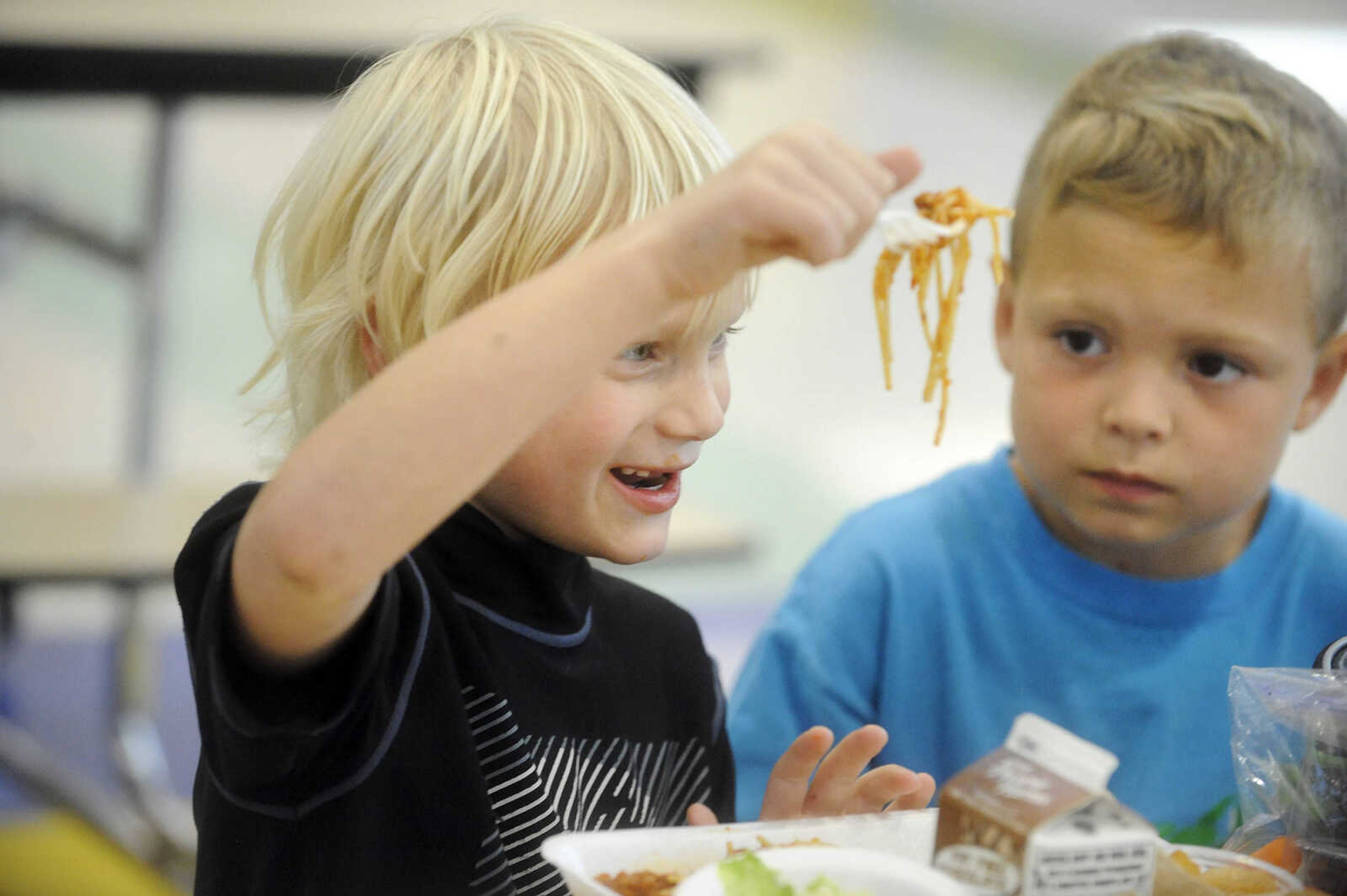 LAURA SIMON ~ lsimon@semissourian.com

Jacob Bonnell, right, watches his classmate, Jayce Pulley, as he eats his spaghetti lunch, Tuesday, Oct. 13, 2015, at East Elementary in Jackson.