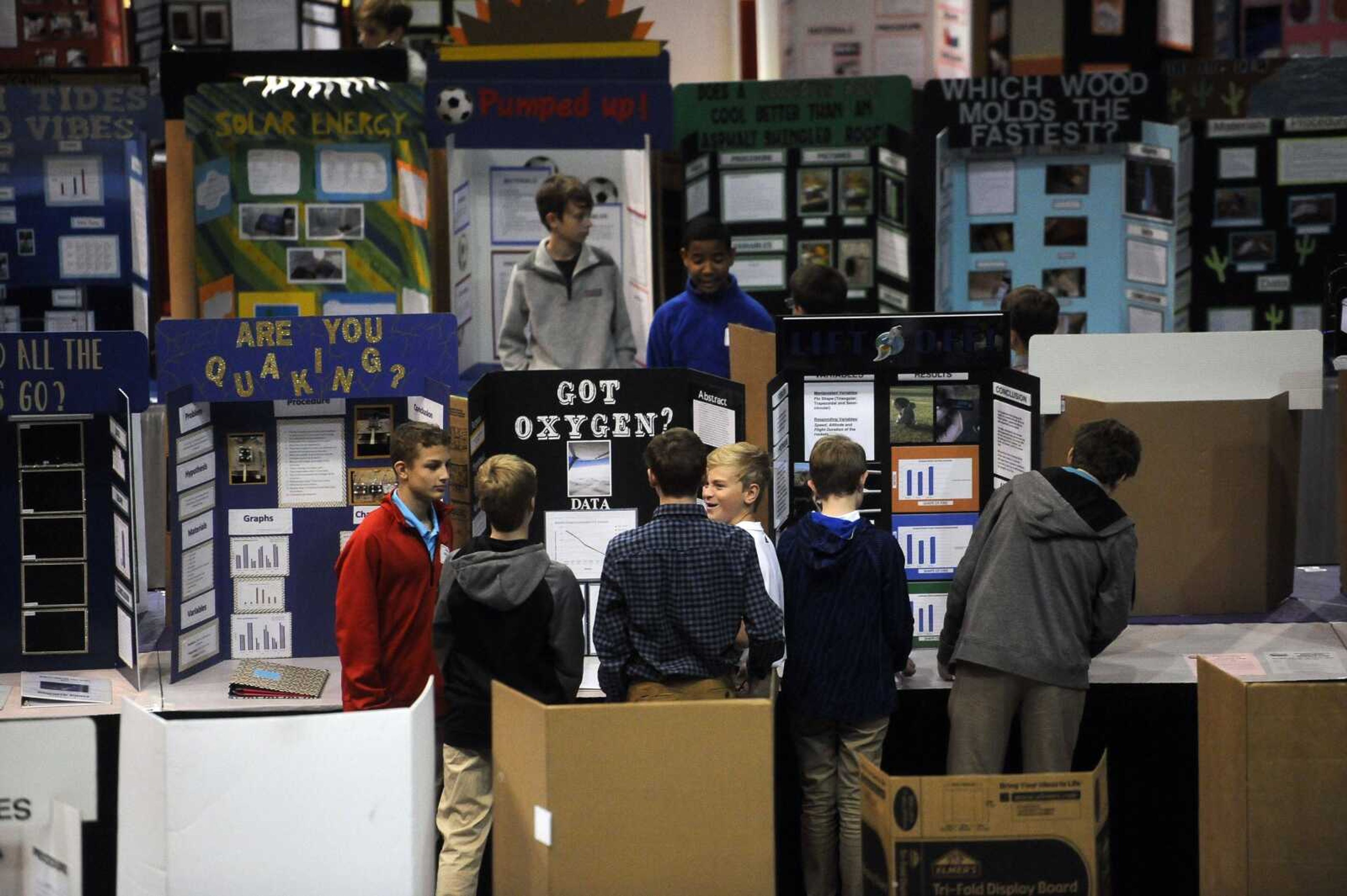 Students mingle in front of project boards at the 62nd annual Southeast Missouri Regional Science Fair on Tuesday at the Show Me Center in Cape Girardeau. A total of 654 students from 36 area schools participated in the science fair.