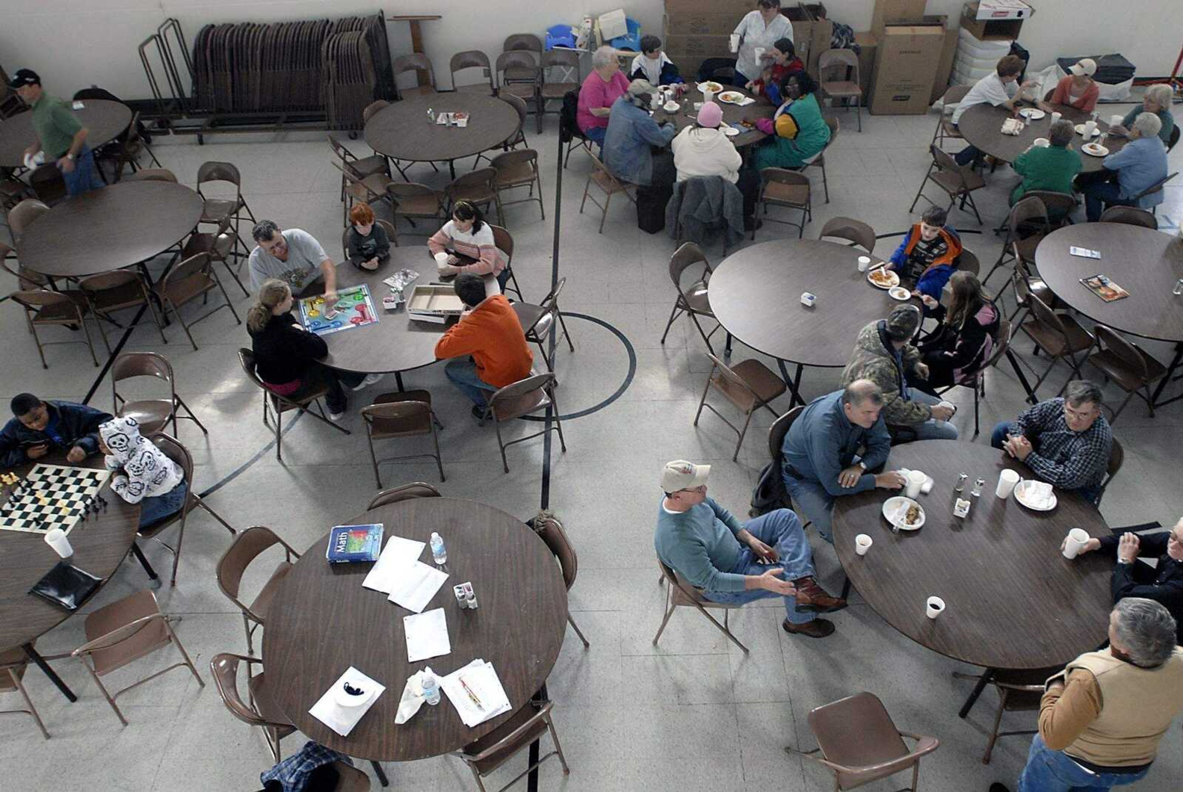 KIT DOYLE ~ kdoyle@semissourian.com
People pass time in a variety of ways at the warming center housed at the First Baptist Church in Charleston.