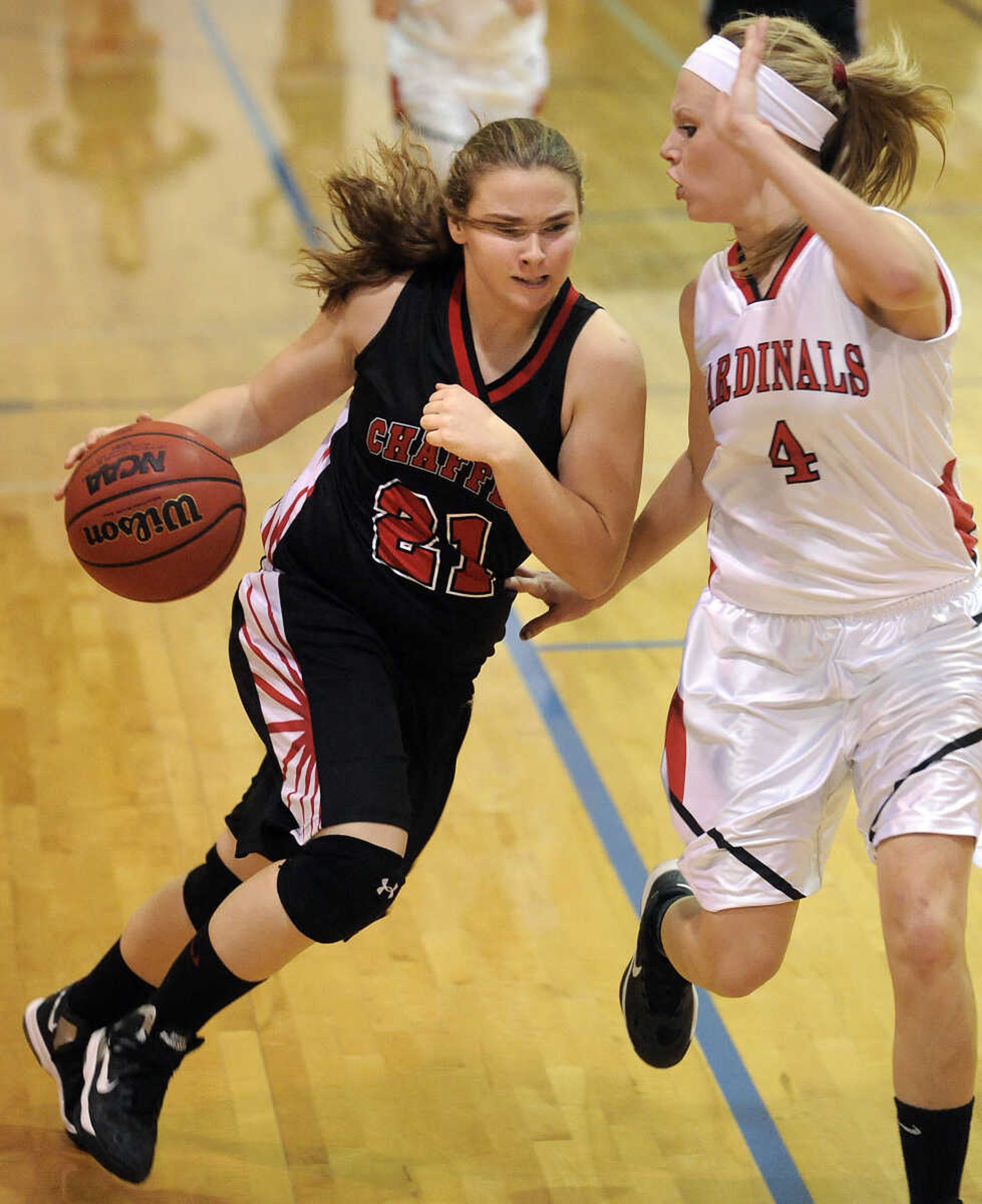 Chaffee's Julia Sutterfield drives against Woodland's Josie Long during the third quarter of the Lady Devils Invitational championship game Saturday, Dec. 8, 2012 in Chaffee, Mo. (Fred Lynch)