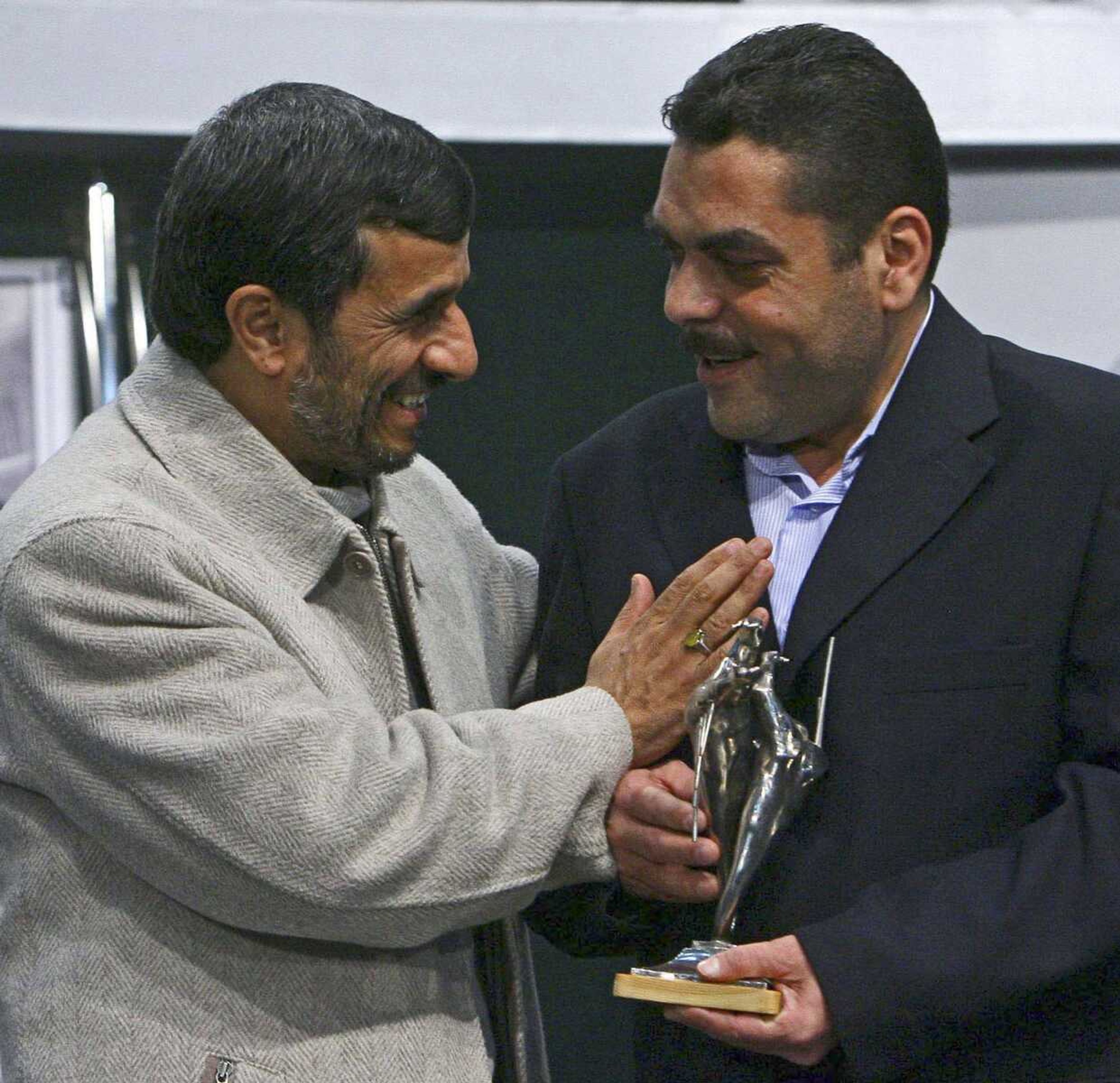 Iranian President Mahmoud Ahmadinejad, left, honors Samir Kantar in 2009 in Tehran, Iran. Kantar was killed in an Israeli airstrike near the Syrian capital, the Hezbollah group said Sunday. (Mehdi Ghasemi ~ Associated Press)