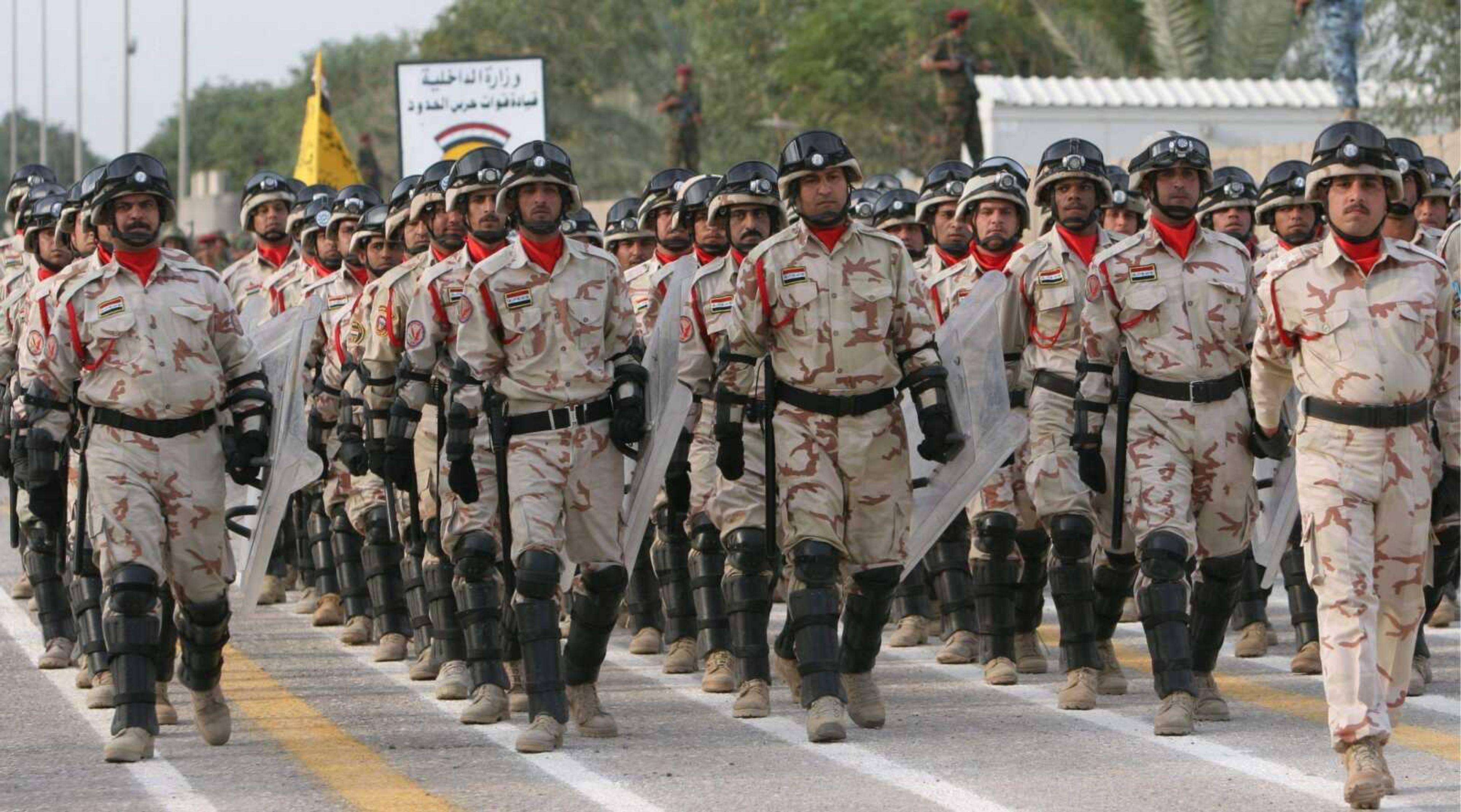 Iraqi soldiers marched Sunday during a handover ceremony in Basra, Iraq's second-largest city, 340 miles southeast of Baghdad. British forces formally handed over responsibility Sunday for the last region in Iraq under their control. (NABIL AL-JURANI ~ Associated Press)