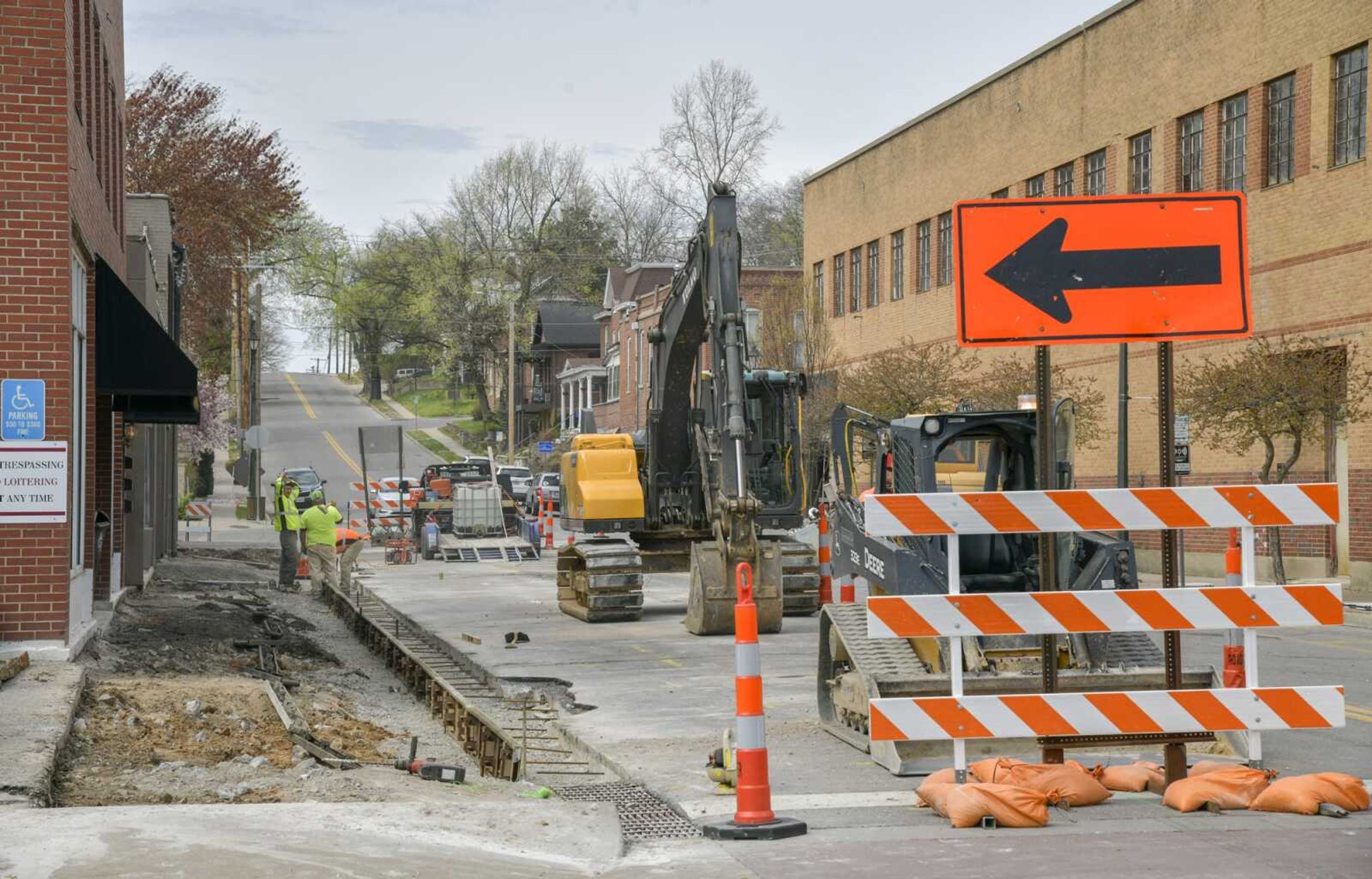 A construction crew begins work Tuesday on the sidewalks of Independence Street between Spanish Street and Main Street as part of the Spanish Street improvement project in Cape Girardeau. The project will improve areas on or near Spanish Street by July and is funded by Riverfront Development Fund, which consists of money received from Century Casino in Cape Girardeau.