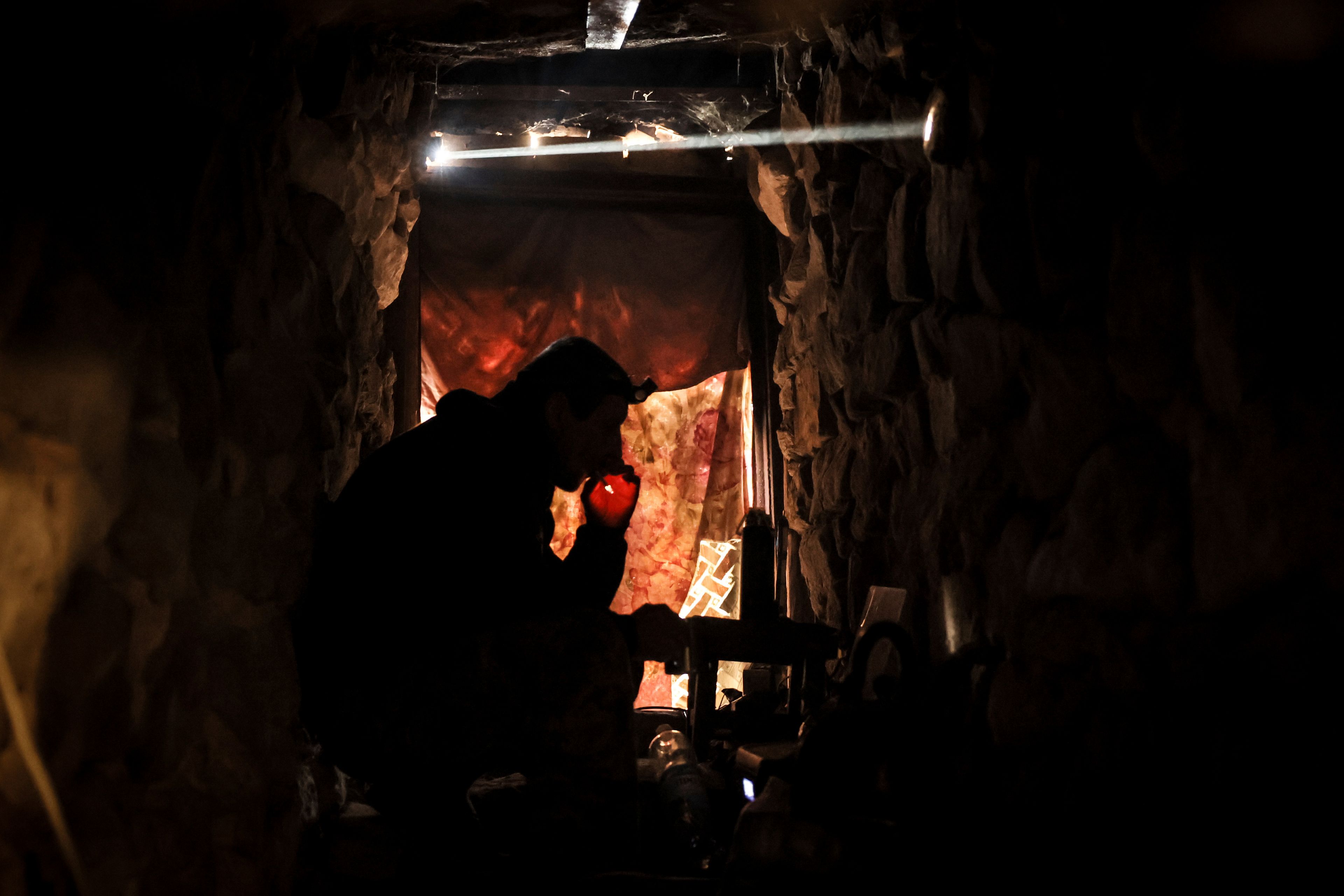 In this photo provided by Ukraine's 24th Mechanised Brigade press service, a serviceman of the 24th Mechanised Brigade rests in a shelter on the front line near Chasiv Yar town, in Donetsk region, Ukraine, Tuesday, Nov. 19, 2024. (Oleg Petrasiuk/Ukrainian 24th Mechanised Brigade via AP)