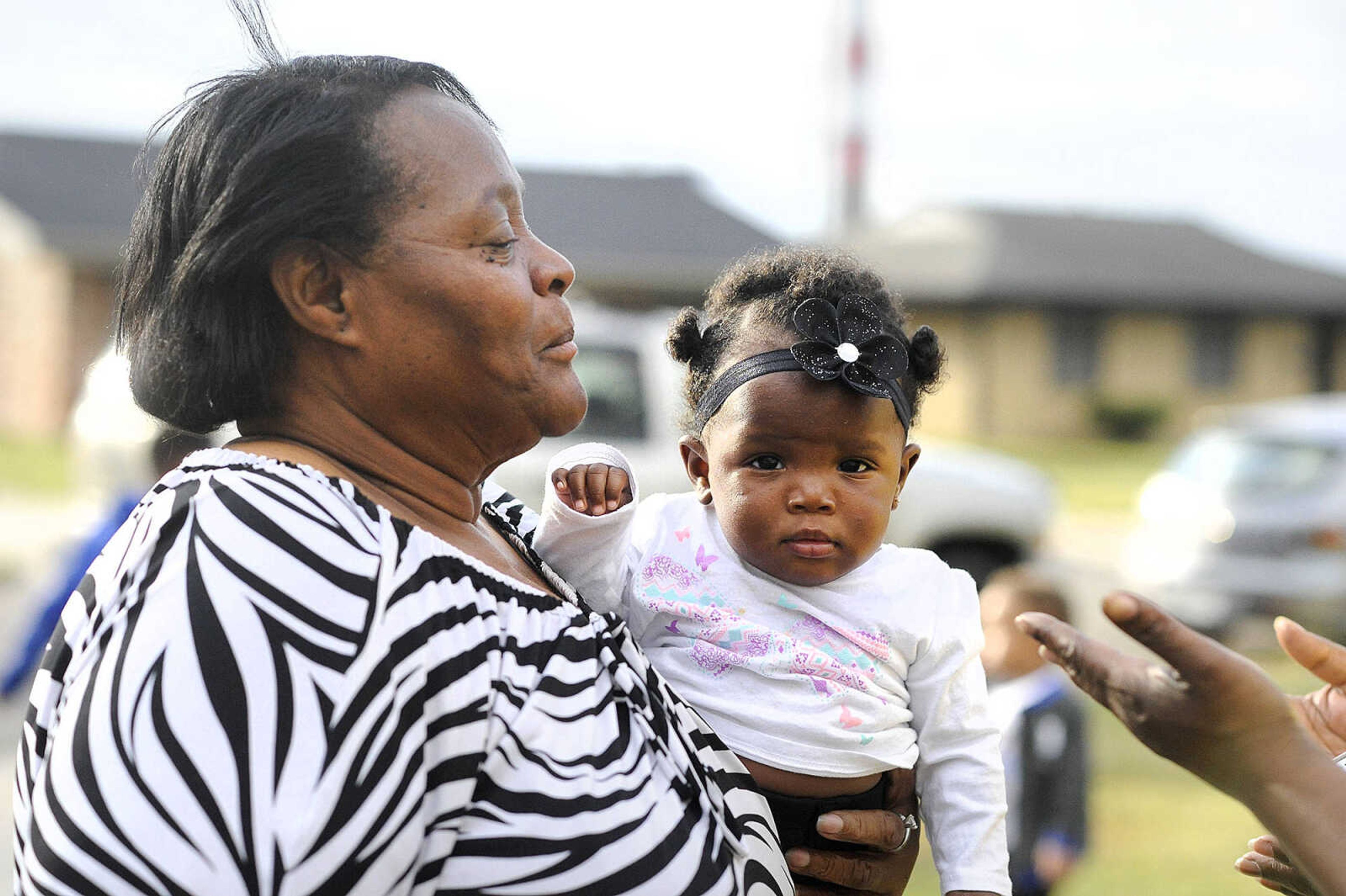 LAURA SIMON ~ lsimon@semissourian.com

Jennett McCaster, David Robinson's mother, holds then seventh-month-old Justice Robinson outside her Sikeston, Missouri home in September.