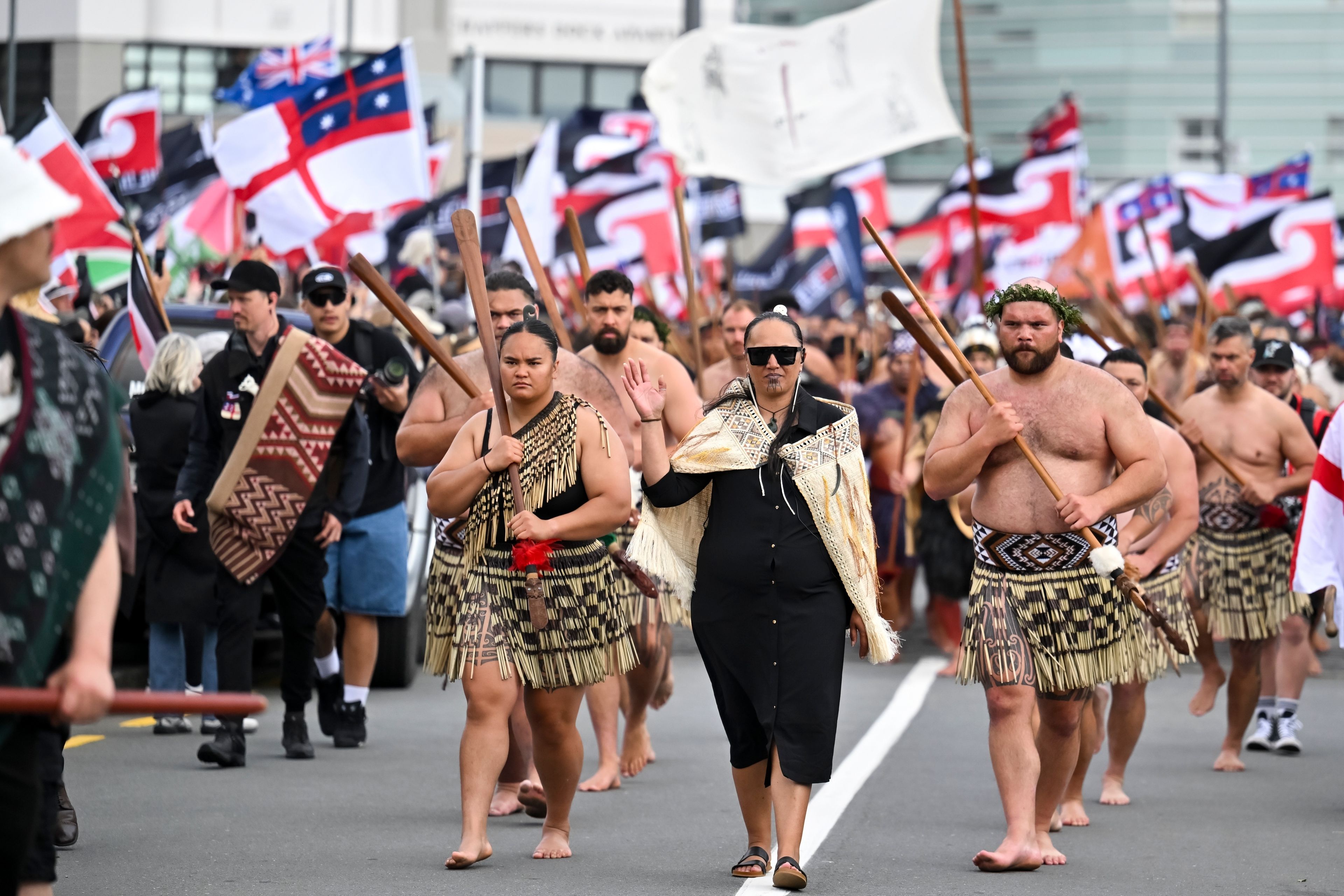 Indigenous Māori people walk through the streets of Wellington, New Zealand to protest against a proposed law that would redefine the country's founding agreement between Indigenous Māori and the British Crown, Tuesday, Nov. 19, 2024. (AP Photo/Mark Tantrum)