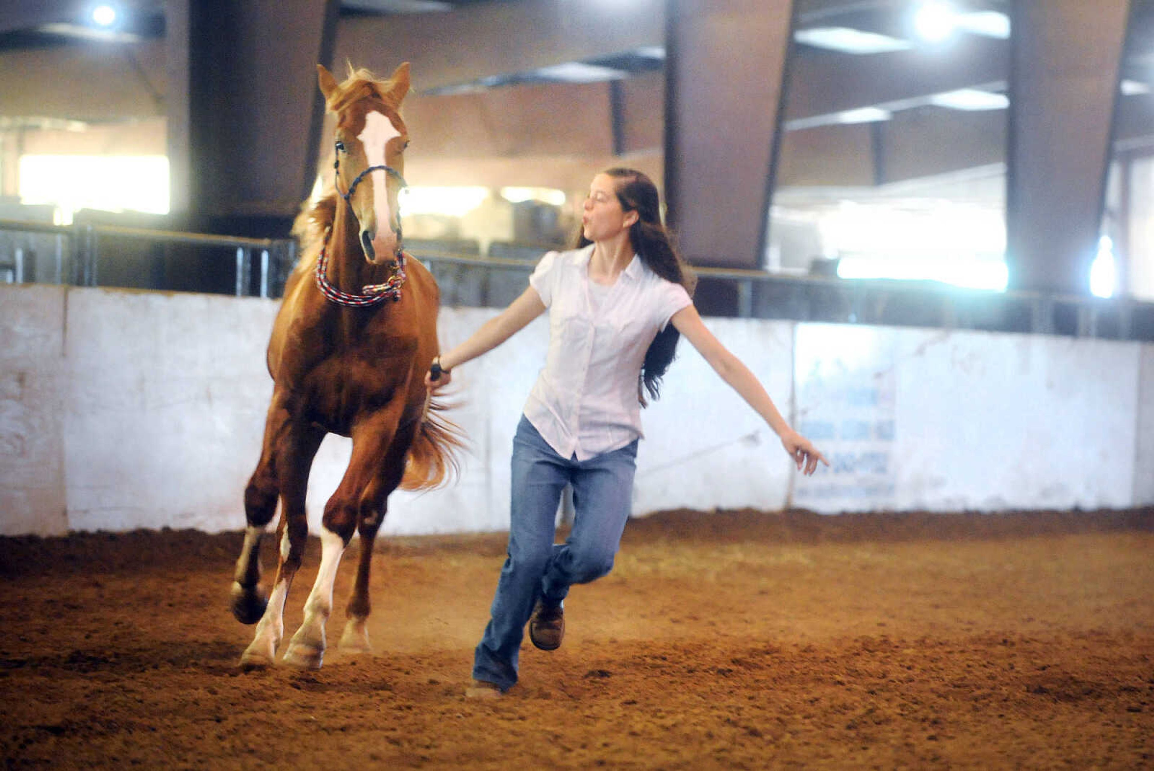 LAURA SIMON ~ lsimon@semissourian.com

Allison Elfrink and her wild mustang, Chico, at Flickerwood Arena in Jackson, Missouri, Wednesday, Aug. 5, 2015.