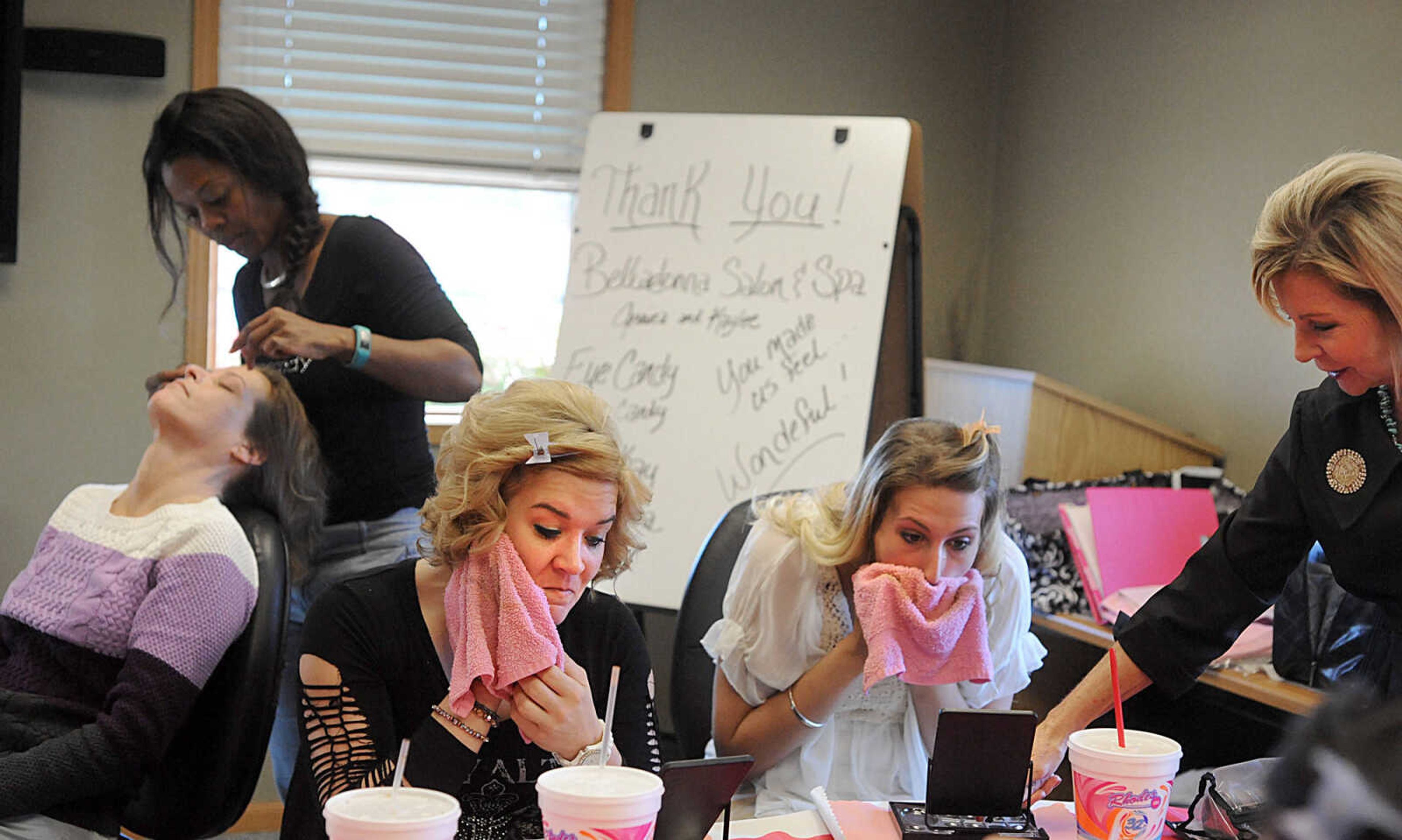 LAURA SIMON ~ lsimon@semissourian.com

Monica, left, and Jessica cleanse their faces, Wednesday, Oct. 29, 2014, during the members of Gibson Recovery Center Inc.'s Vision House program beauty day. Consultants from Belladona Salon and Spa, Mary Kay, and Eye Candy gave the members a fresh look with an eyebrow threading, haircut and makeup session.