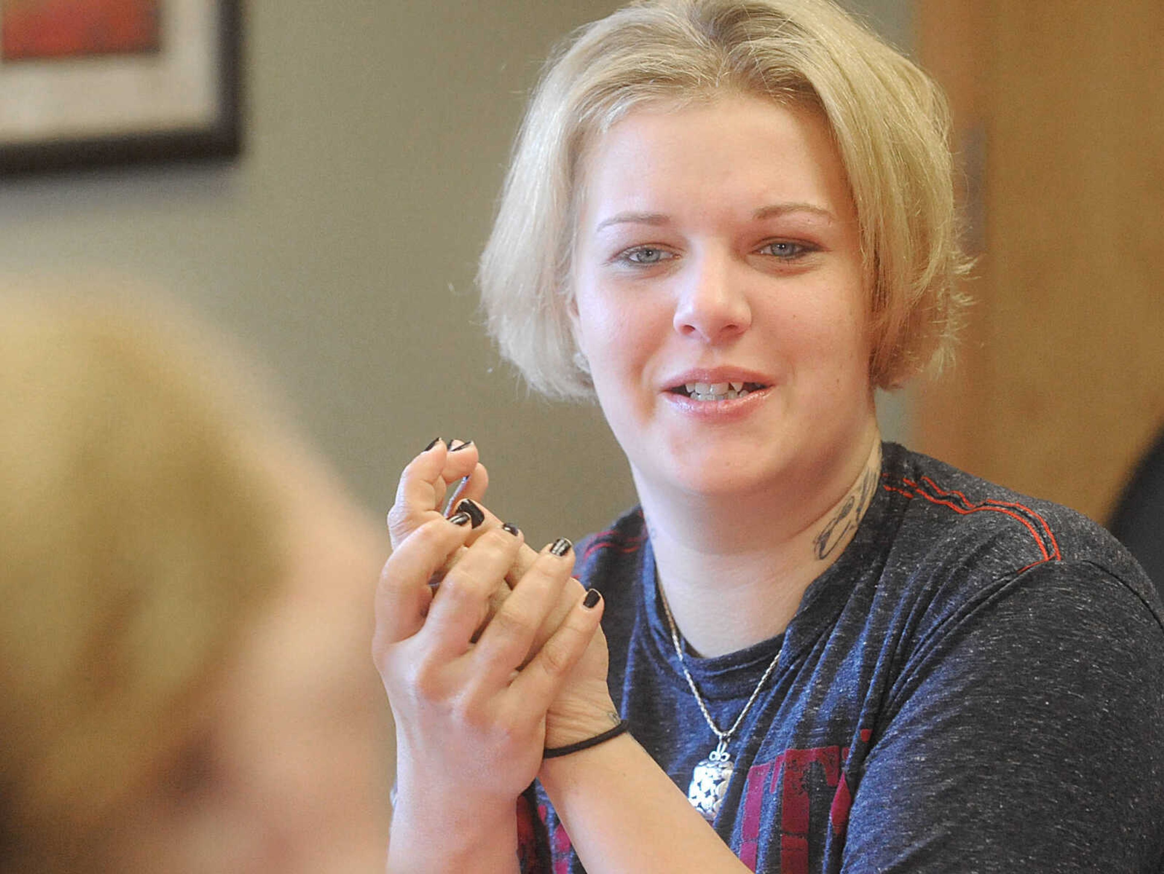 LAURA SIMON ~ lsimon@semissourian.com

Whitney uses a skin softening treatment on her hands, Wednesday, Oct. 29, 2014, during the members of Gibson Recovery Center Inc.'s Vision House program beauty day. Consultants from Belladona Salon and Spa, Mary Kay, and Eye Candy gave the members a fresh look with an eyebrow threading, haircut and makeup session.