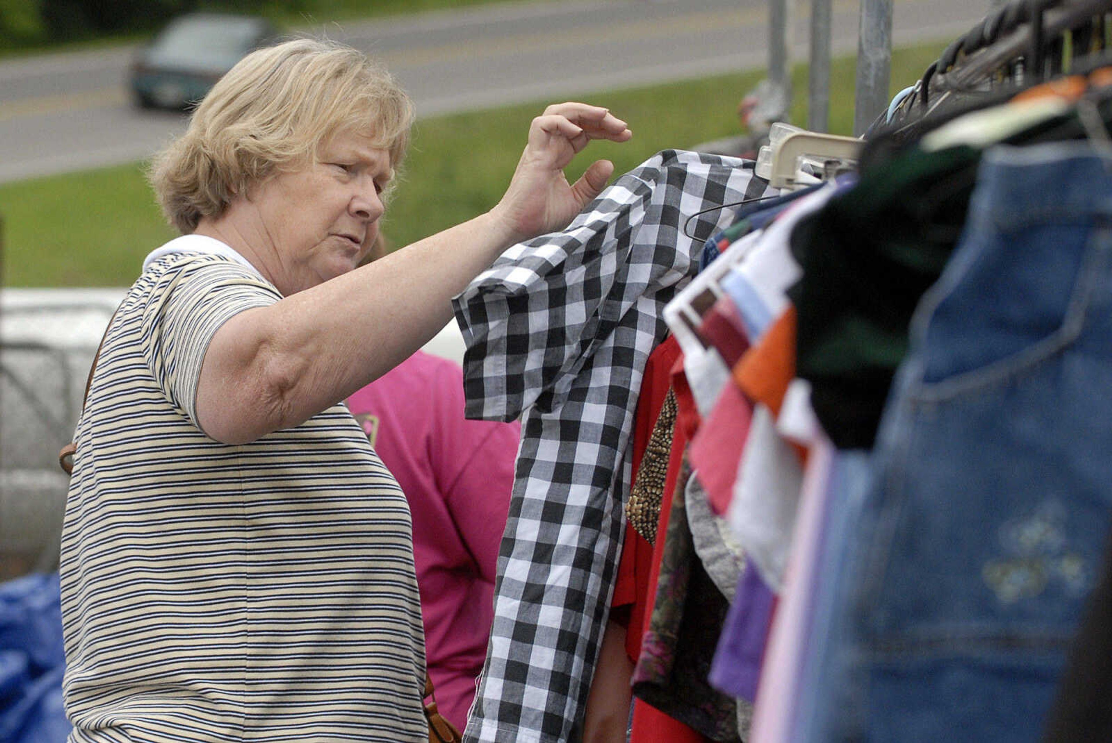 LAURA SIMON~lsimon@semissourian.com
Nancy Strange hunts for bargains Friday, May 27, 2011 near Dutchtown during the 100-Mile Yard sale.