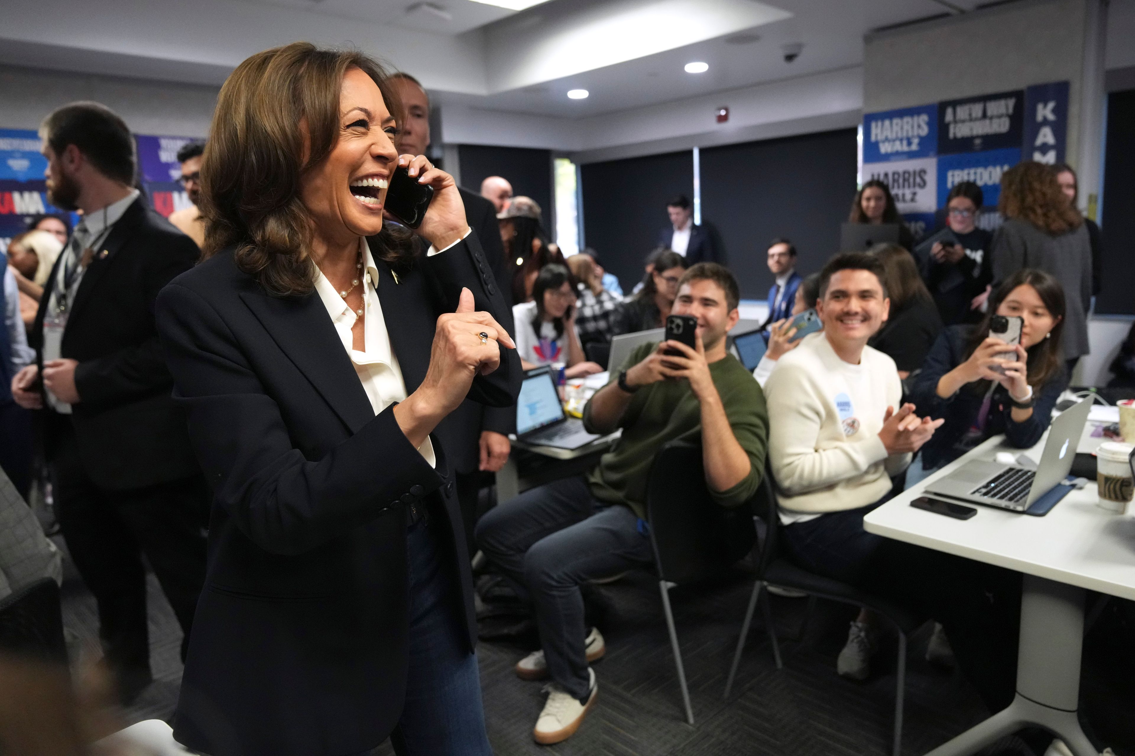 Democratic presidential nominee Vice President Kamala Harris, left, phone banks with volunteers at the DNC headquarters on Election Day, Tuesday, Nov. 5, 2024, in Washington. (AP Photo/Jacquelyn Martin)