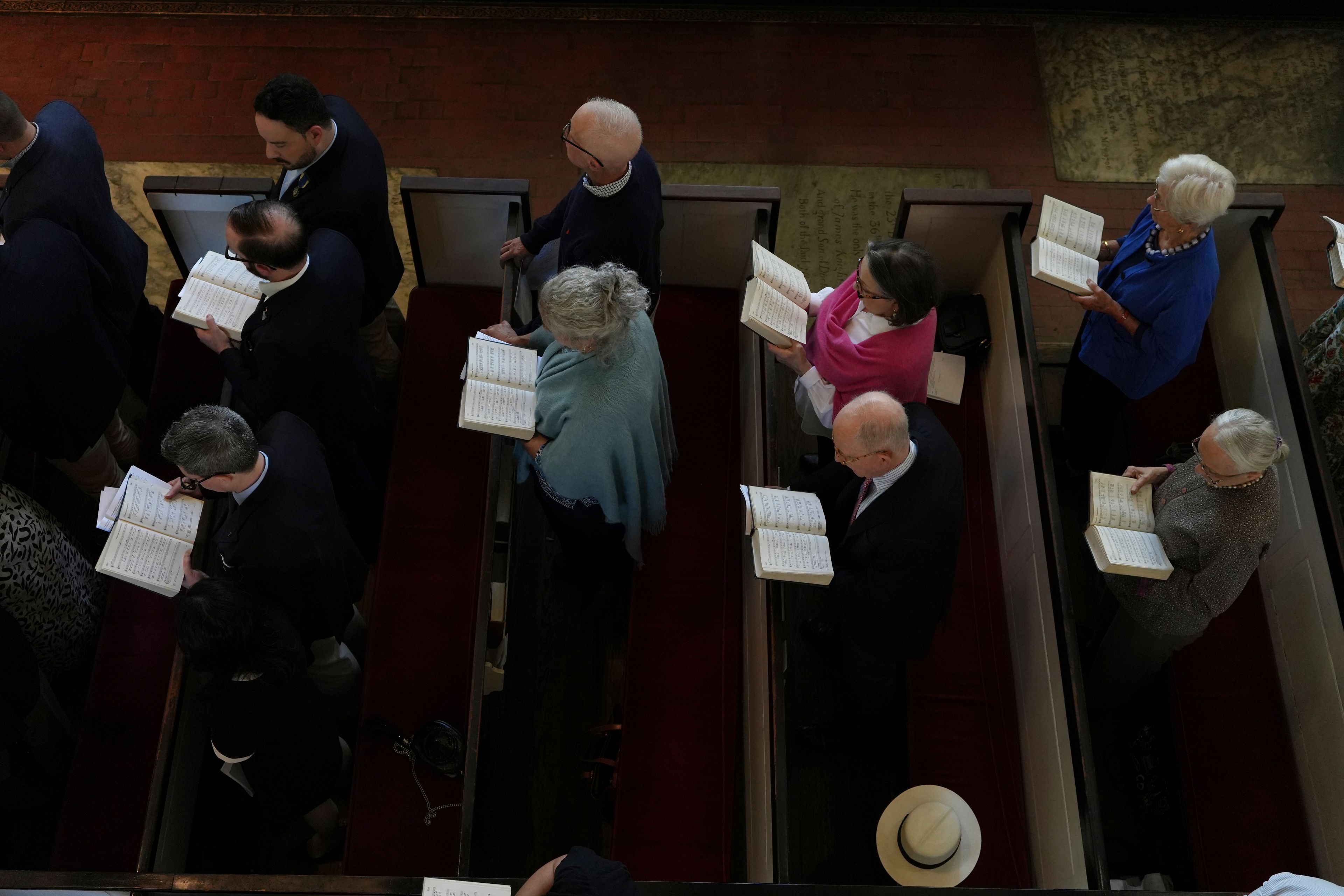 Christ Church congregants sing during a service in Philadelphia on Sunday, Oct. 6, 2024. (AP Photo/Luis Andres Henao)