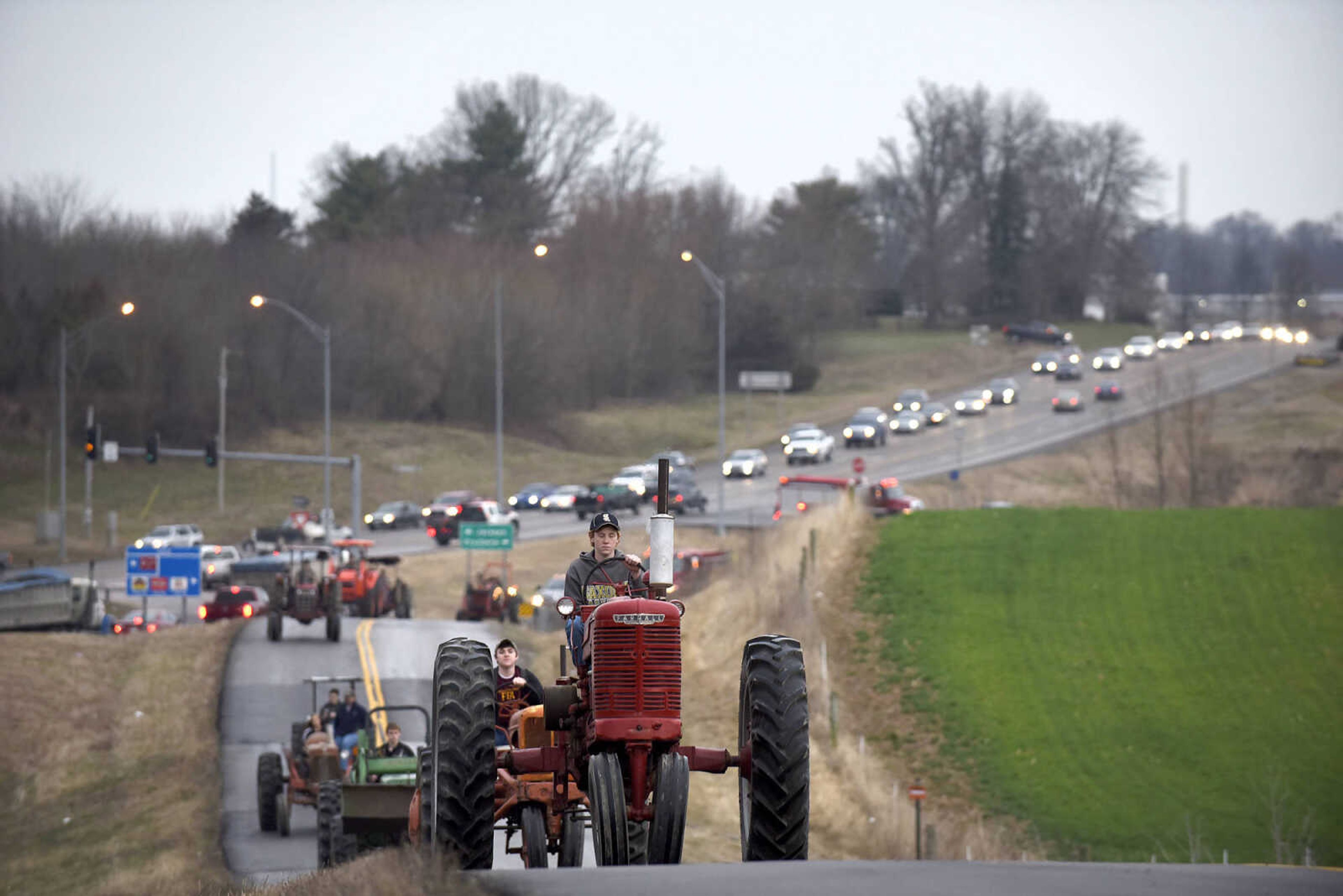 Saxony Lutheran High School FFA students take to the road on their tractors during drive your tractor to school day on Tuesday morning, Feb. 21, 2017. Students began their journey to school from Davis Farm Supply on Highway 61 in Jackson as part of FFA Week.