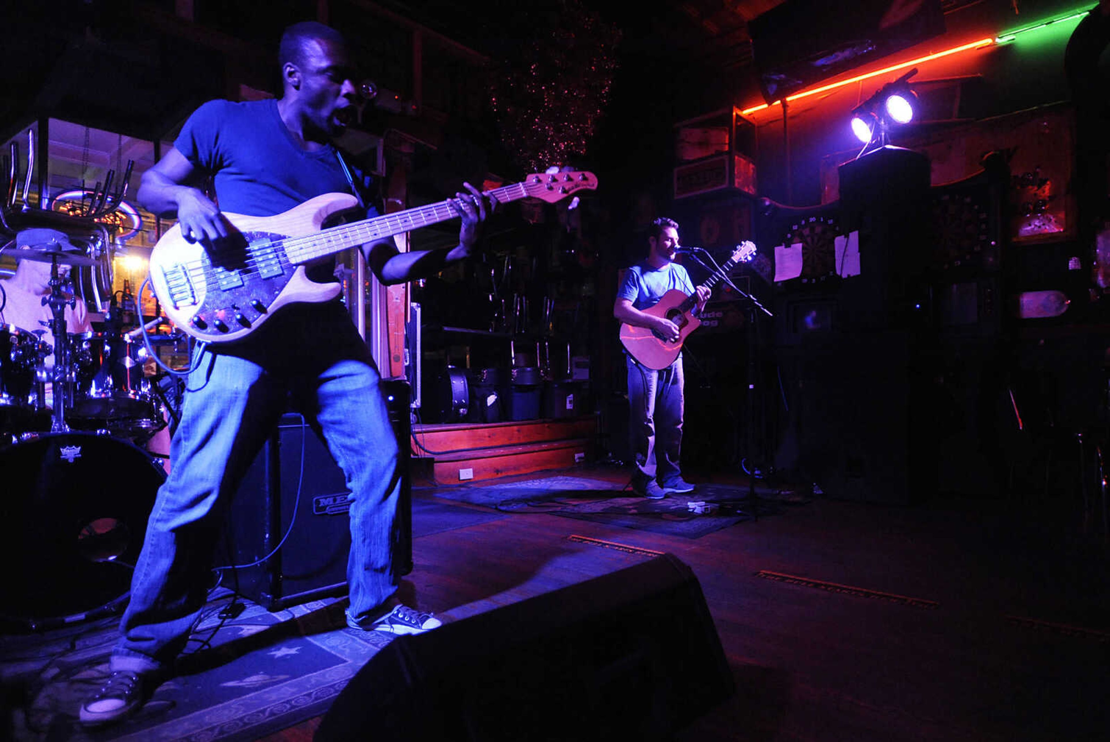 Jamed Hams, left and Mike Renick play during a performance by the Mike Renick Band at the Rude Dog Pub, 123 Main Street, Friday, June 22.