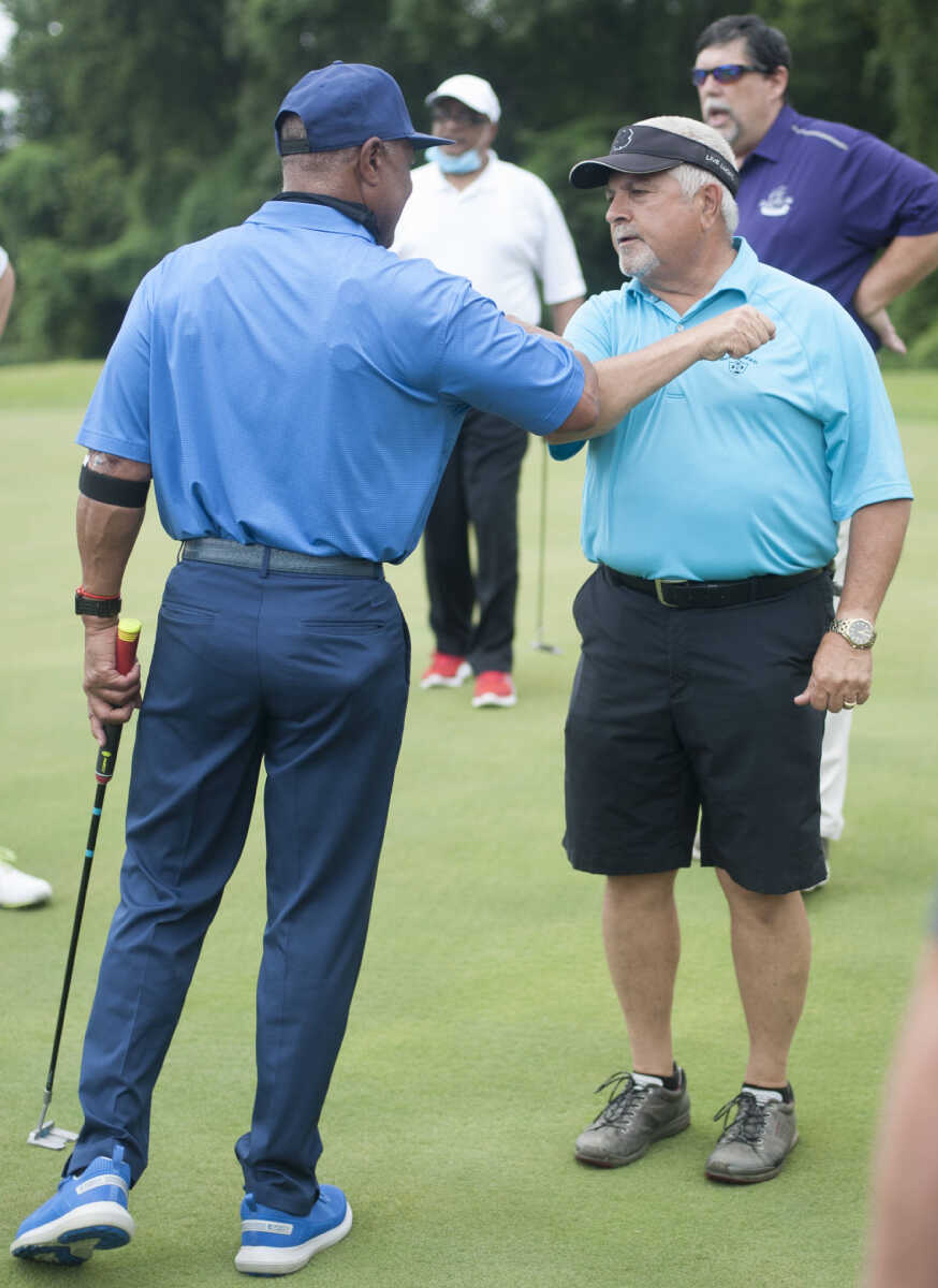 Former St. Louis Cardinals shortstop and Hall of Famer Ozzie Smith bumps elbows with Cape Girardeau Mayor Bob Fox on Friday, June 26, 2020, during a visit to the Cape Girardeau Country Club.