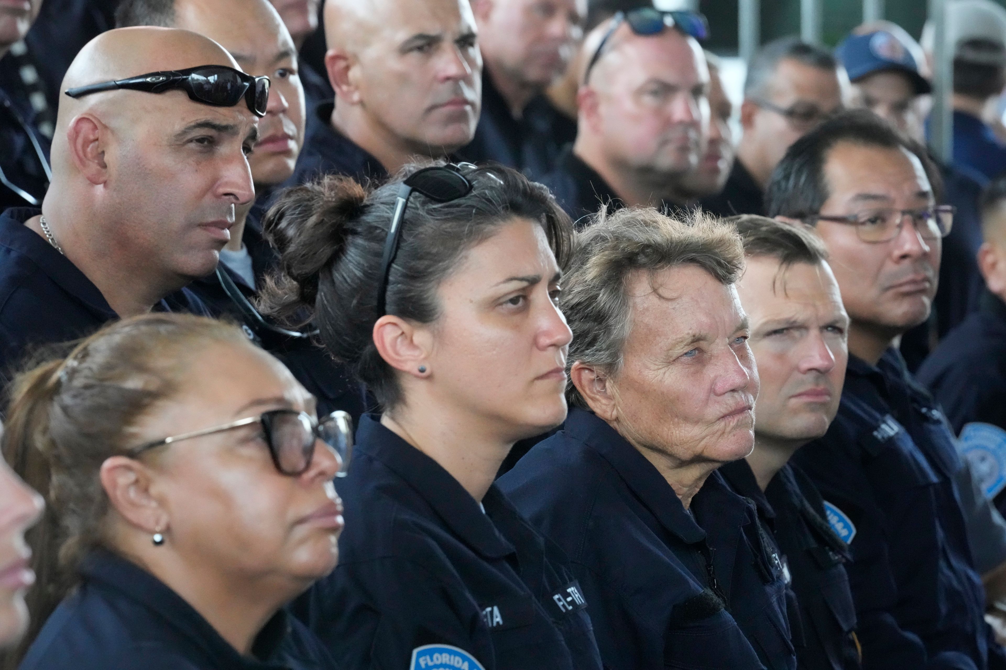 Members of Miami-Dade Fire Rescue's Urban Search and Rescue Florida Task Force One are addressed by officials before they deploy ahead of Hurricane Milton, Wednesday, Oct. 9, 2024, in Doral, Fla. (AP Photo/Wilfredo Lee)