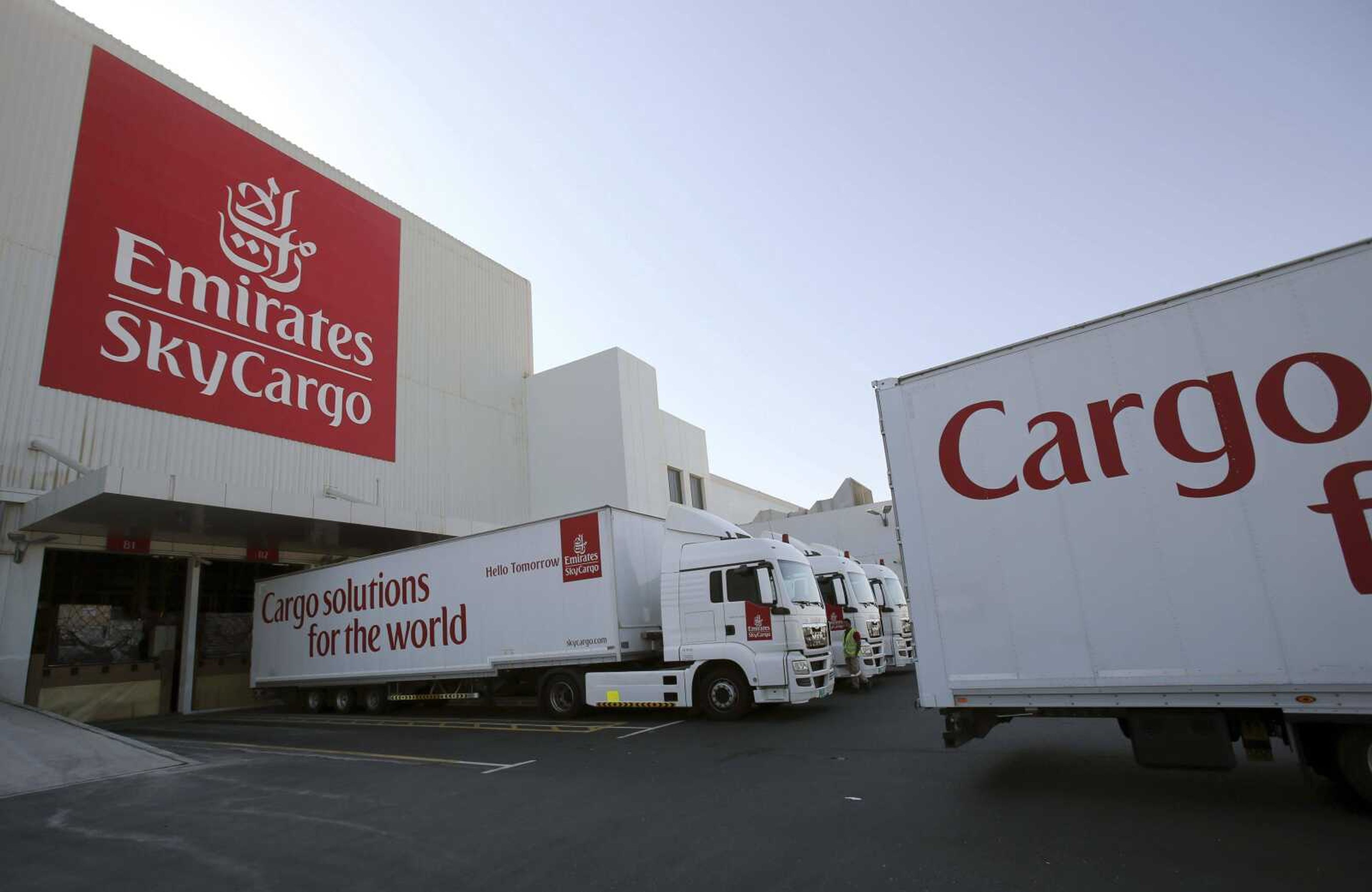 In this Nov. 9, 2015, file photo, trucks are uploaded at the Emirates SkyCentral of the Al Maktoum International Airport in Dubai, United Arab Emirates. The U.S. aviation security agency says it has issued an emergency order requiring additional screening of airline cargo on flights departing for the United States from five Mideast countries. to prevent a terrorist attack.