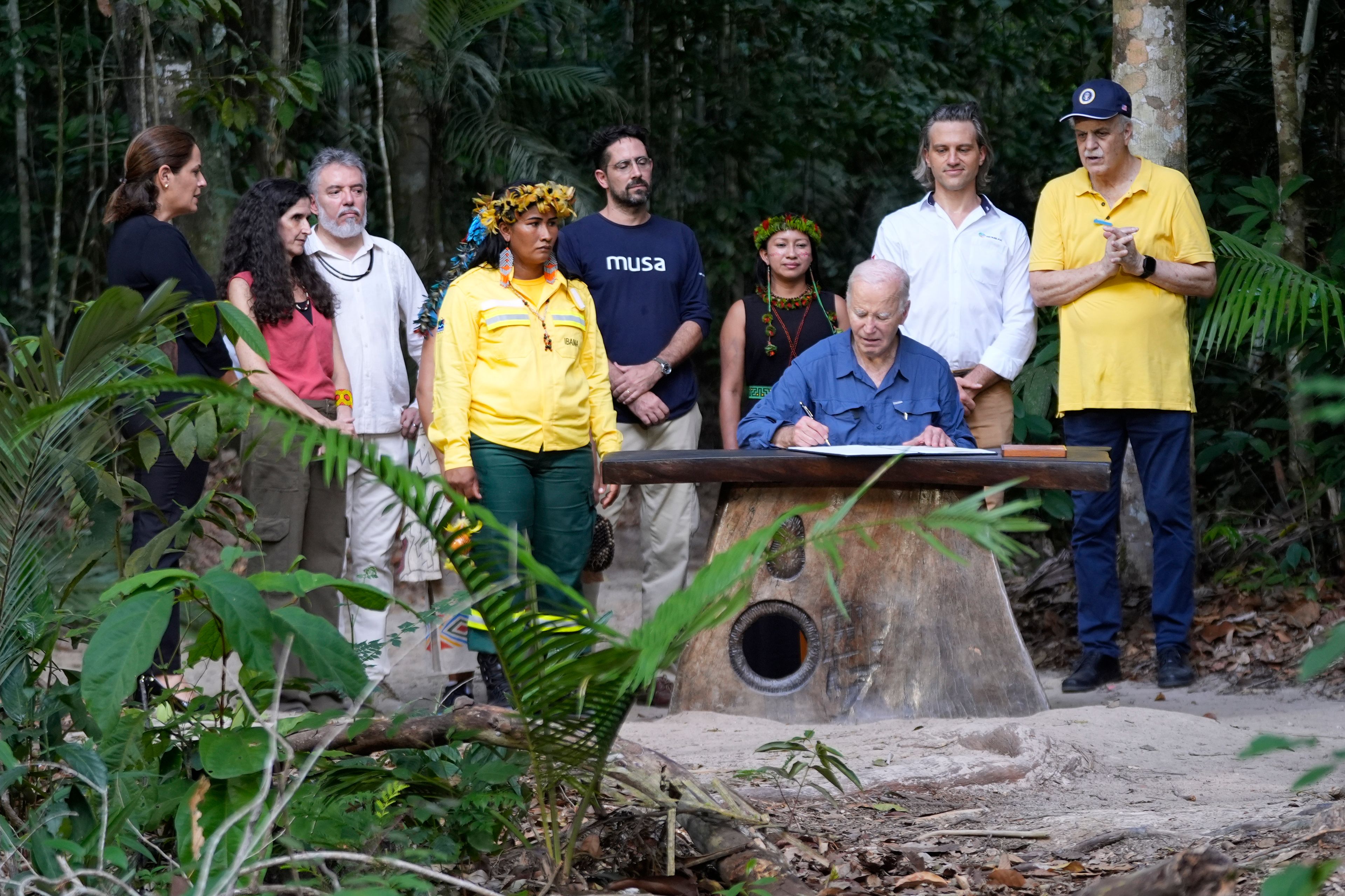 President Joe Biden signs a proclamation designating Nov. 17 as International Conservation Day following a tour of the Museu da Amazonia, Sunday, Nov. 17, 2024, in Manaus, Brazil. (AP Photo/Manuel Balce Ceneta)