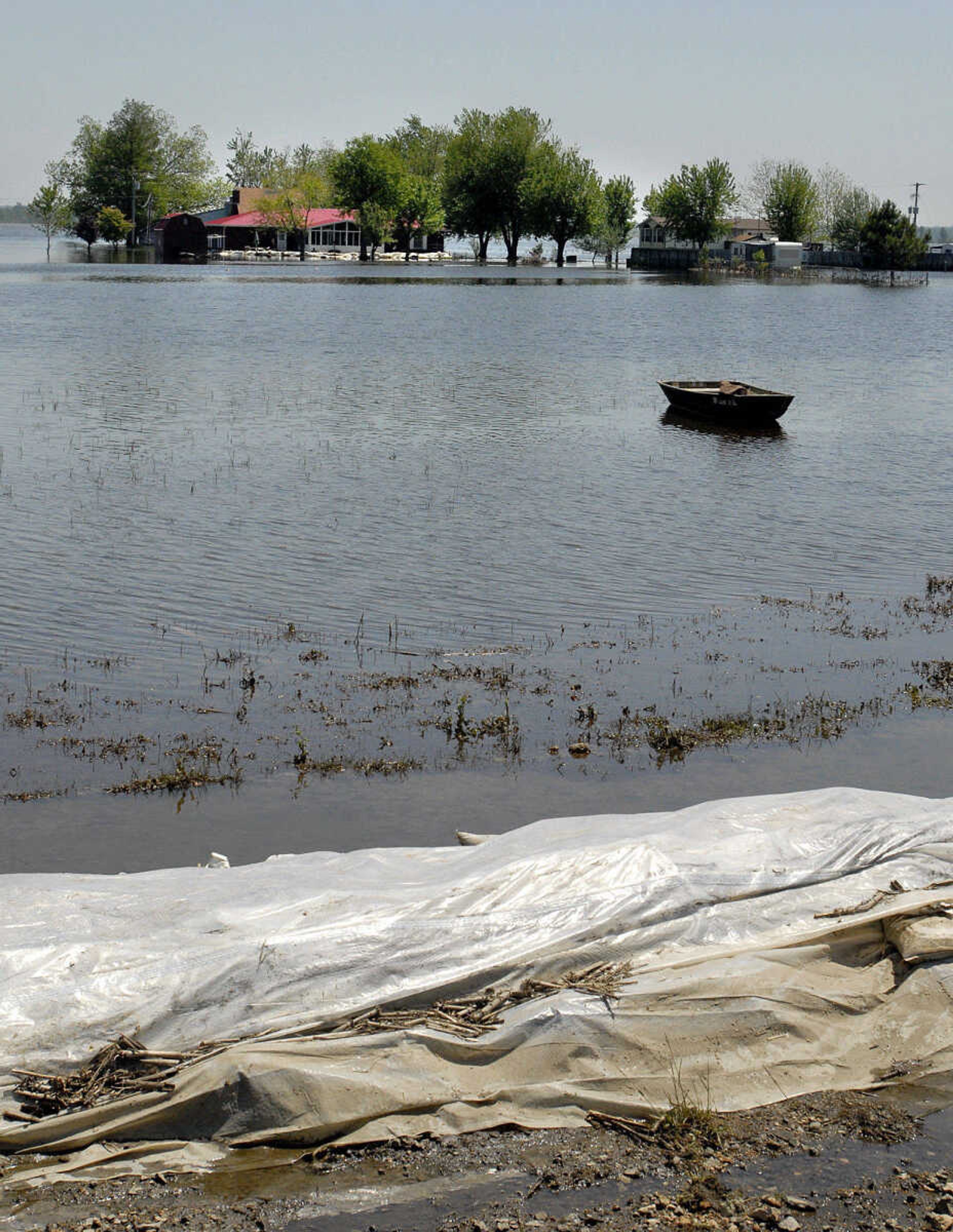 LAURA SIMON~lsimon@semissourian.com
Floodwaters in Olive Branch, Ill. have receded leaving behind a row of sandbags and debris such as corn husks from nearby farmland.