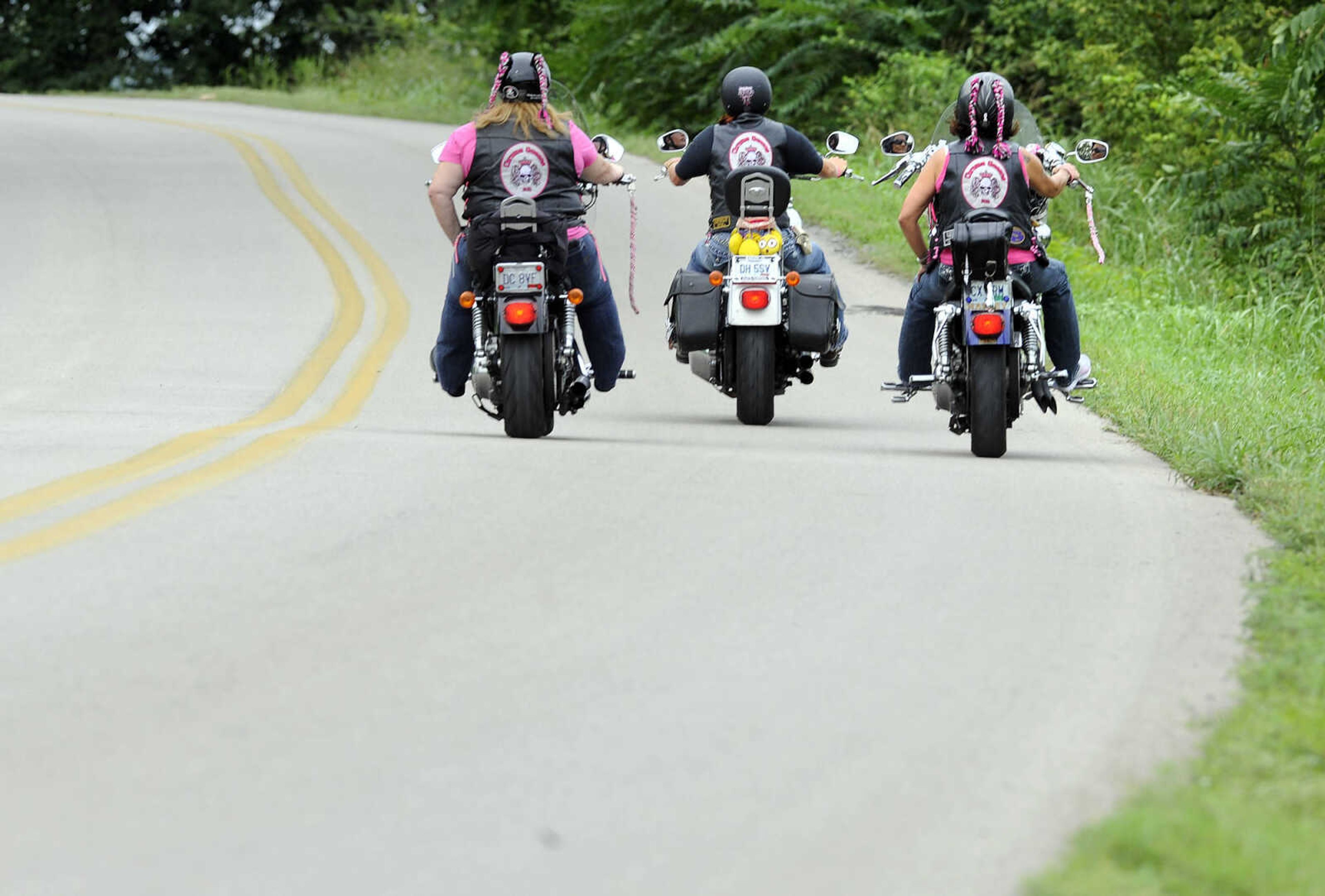 LAURA SIMON ~ lsimon@semissourian.com

The Chrome Queens cruise down Aquamsi Street in Cape Girardeau on Thursday, Aug. 18, 2016.