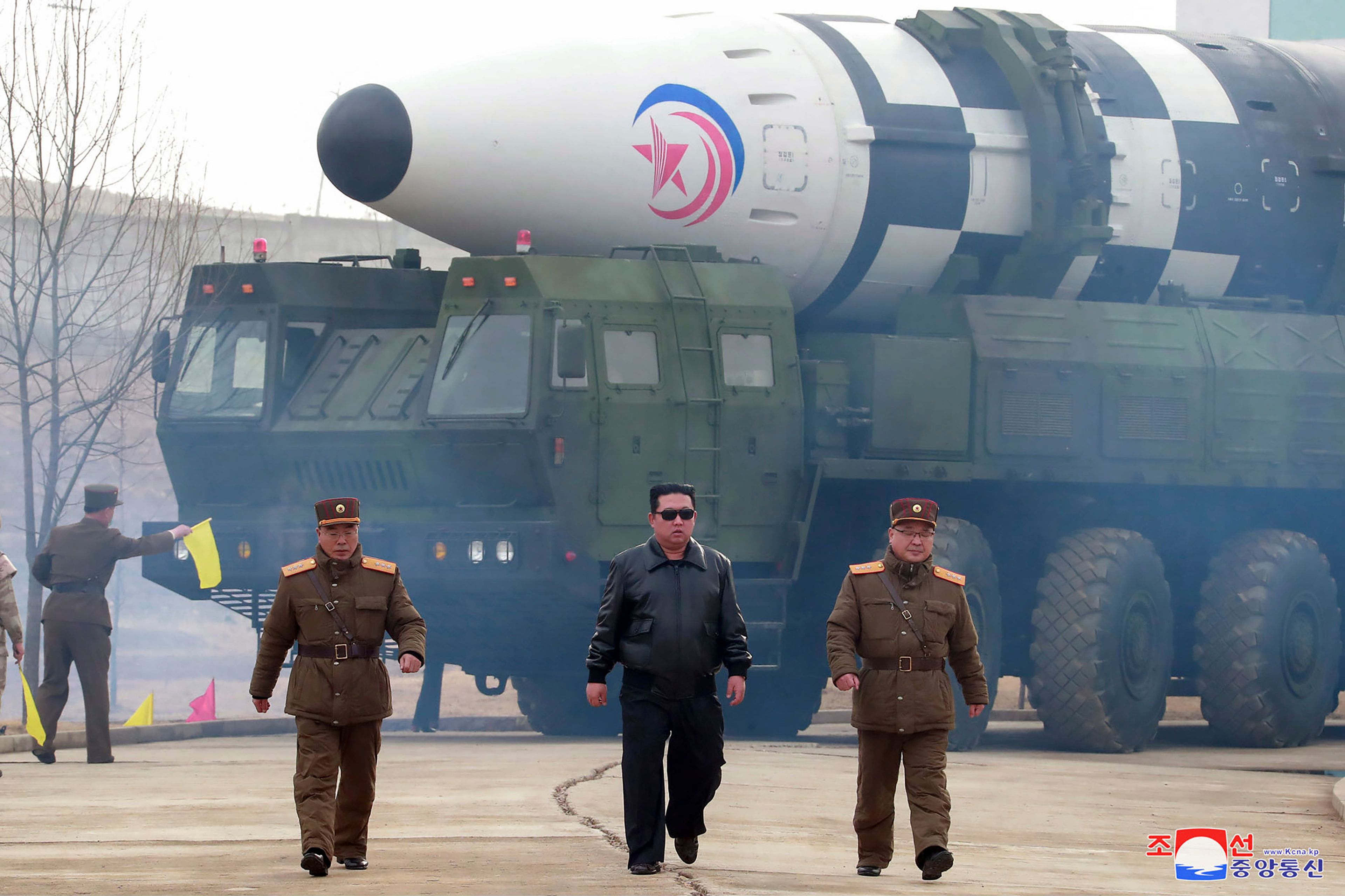 FILE - In this photo distributed by the North Korean government, North Korean leader Kim Jong Un, center, walks near what it says is a Hwasong-17 intercontinental ballistic missile (ICBM) on the launcher at an undisclosed location in North Korea on March 24, 2022. Independent journalists were not given access to cover the event depicted in this image distributed by the North Korean government. The content of this image is as provided and cannot be independently verified. Korean language watermark on image as provided by source reads: "KCNA" which is the abbreviation for Korean Central News Agency. (Korean Central News Agency/Korea News Service via AP, File)