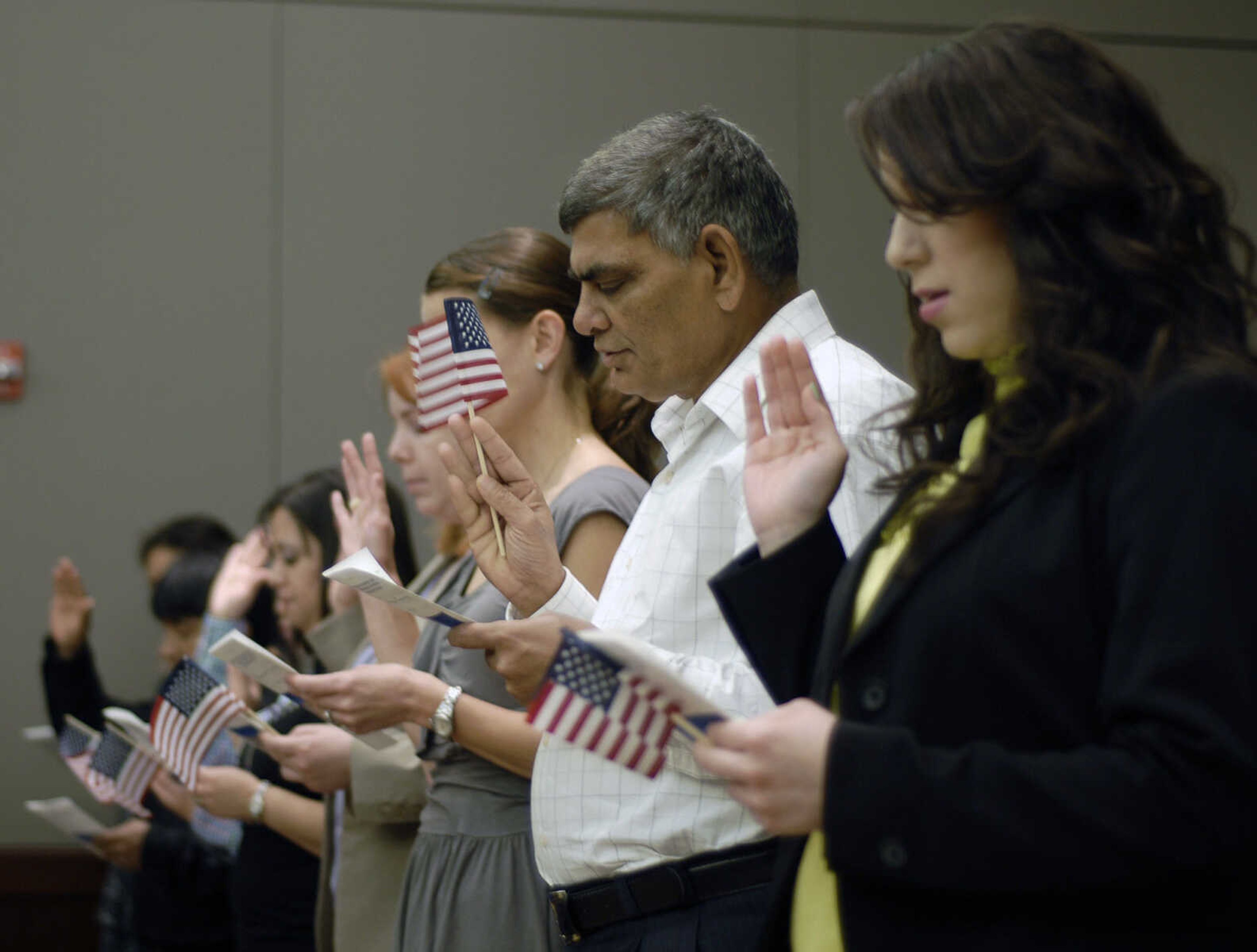 Bob Miller~bmiller@semissourian.com
Eighteen new citizens of the United States of America pledge their Oath of Allegiance Monday, April 25, 2011 during the Naturalization Ceremony at the Rush Hudson Limbaugh, Sr. United States Courthouse in Cape Girardeau.