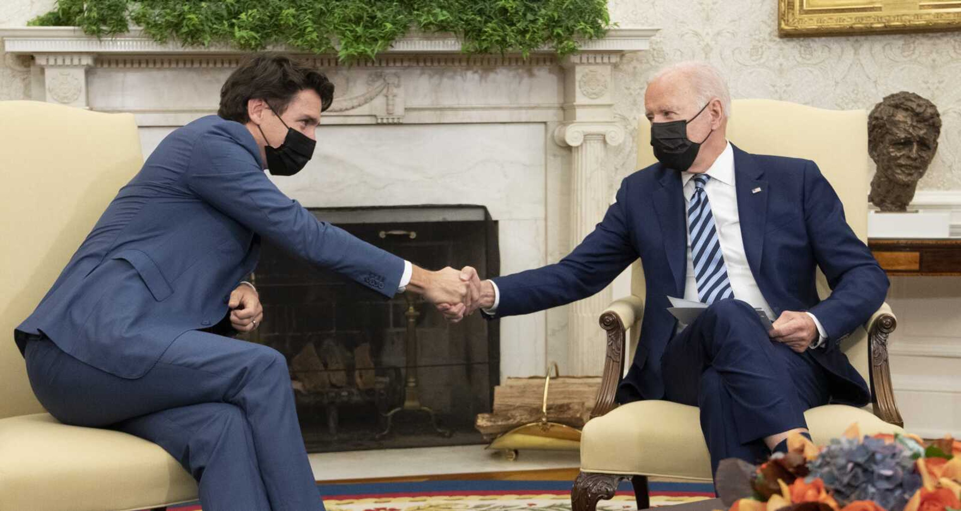 President Joe Biden shakes hands with Canadian Prime Minister Justin Trudeau as they meet in the Oval Office of the White House on Thursday in Washington.