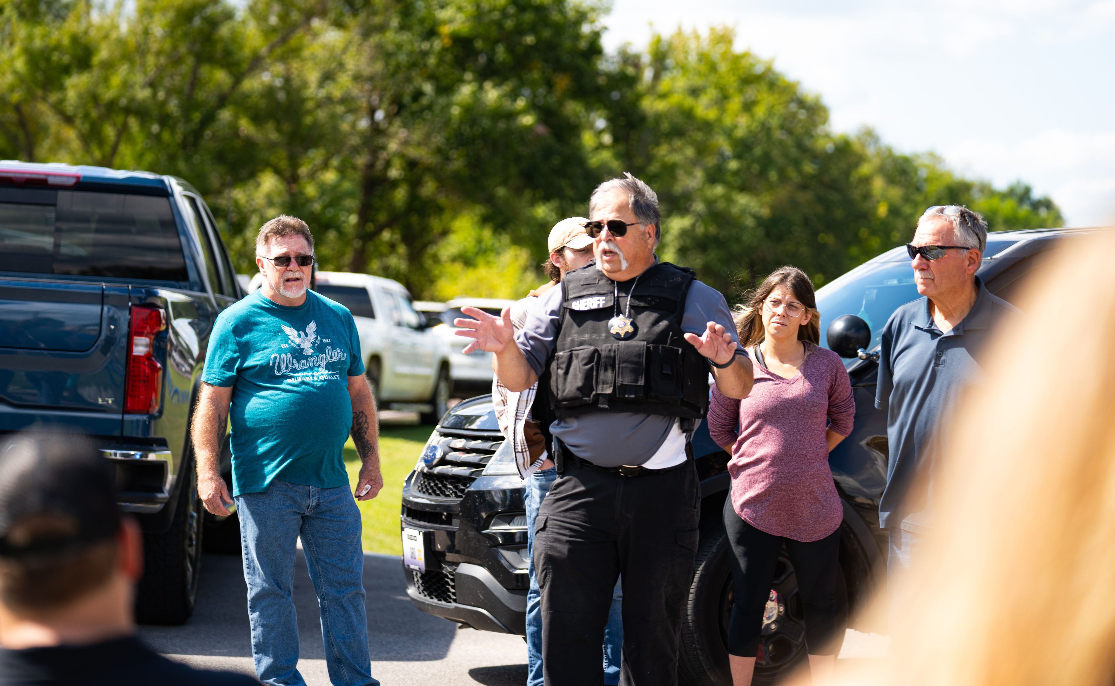 Scott County Sheriff Wes Drury speaks to parents waiting outside of Scott City schools Thursday, Sept. 26, after an alleged firearm threat in Scott City.