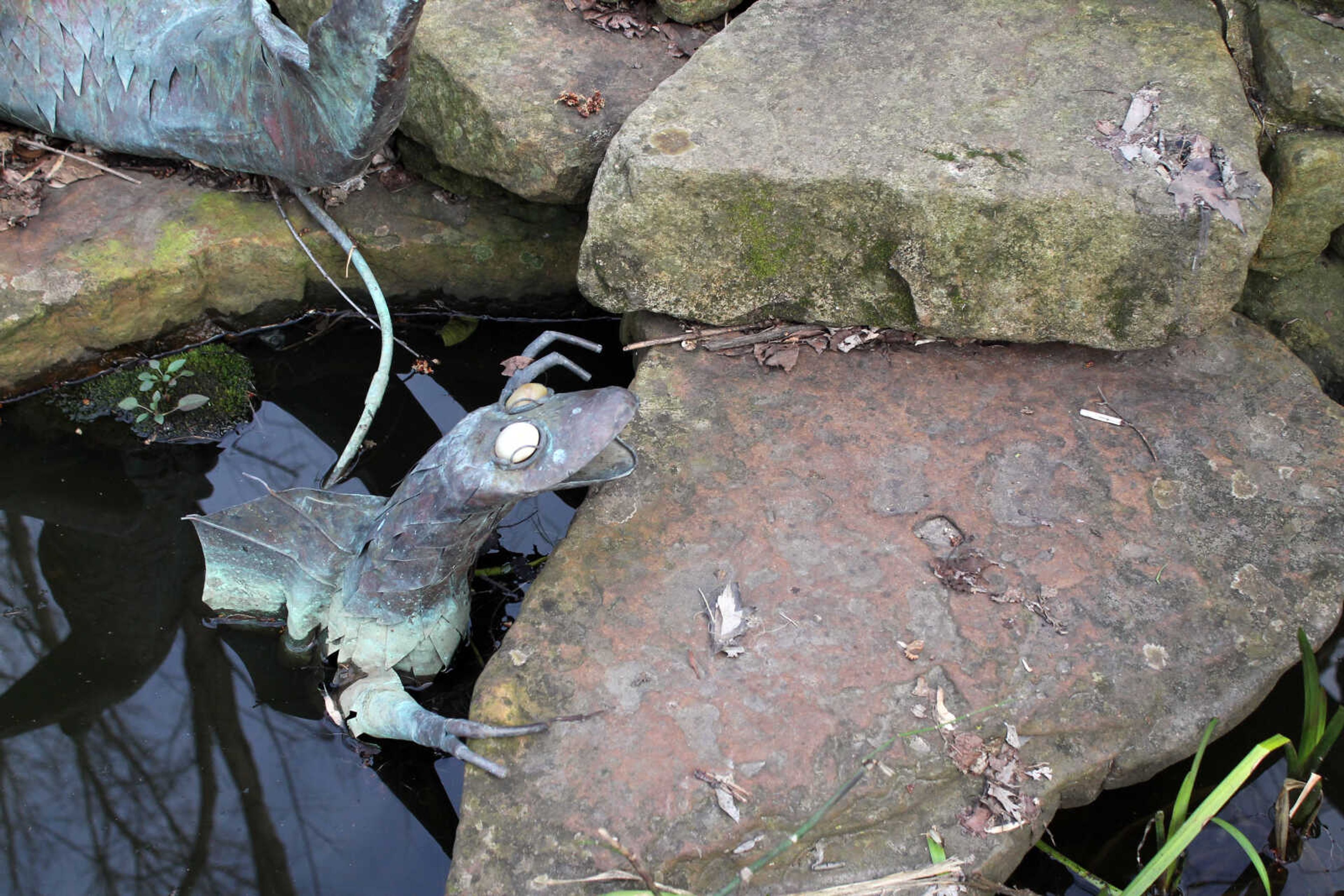 Emily Priddy ~ epriddy@semissourian.com
A whimsical metal reptile emerges from a pond Friday, March 10, 2017, in the garden behind Rainmaker Studio in Makanda, Illinois.