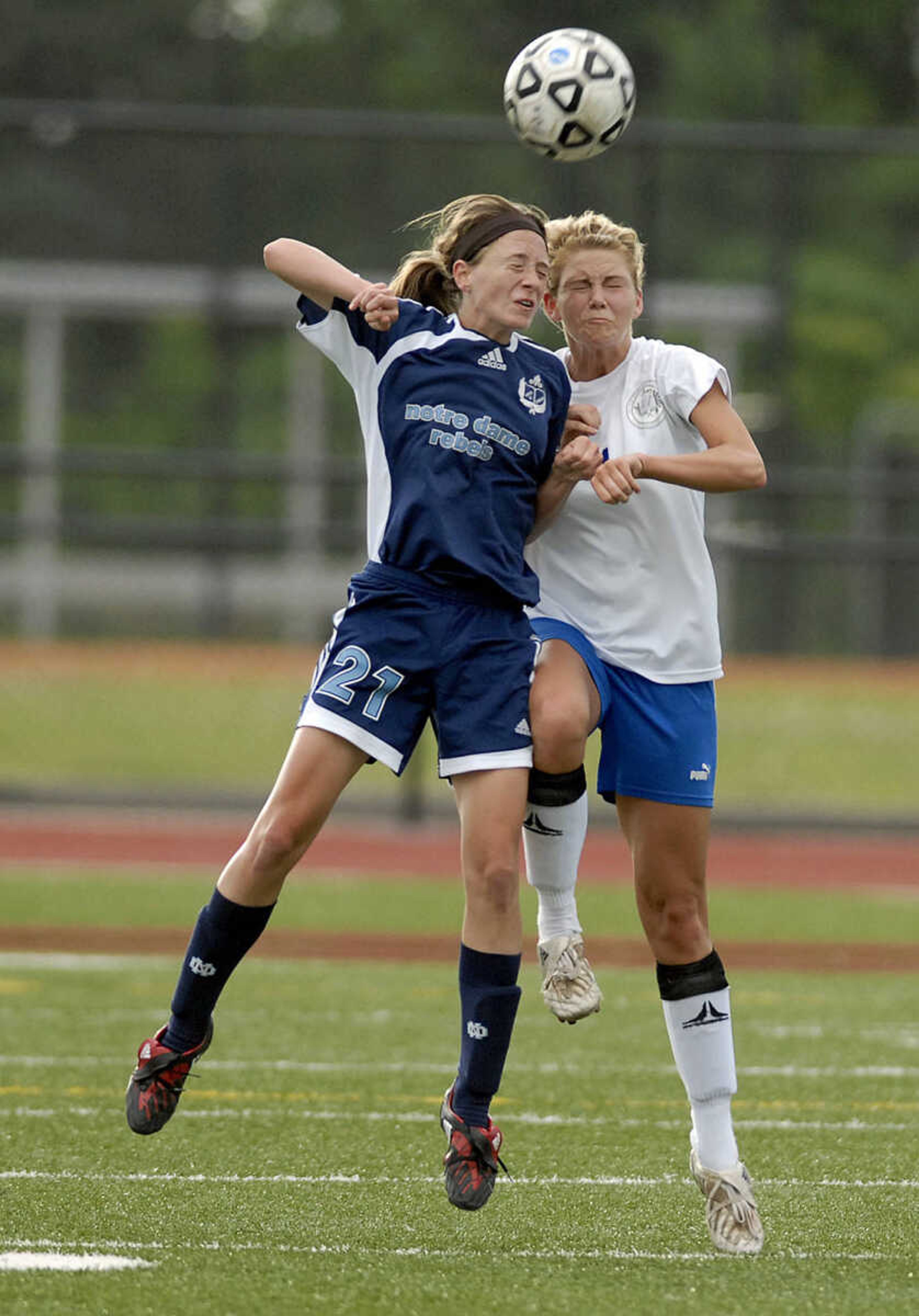 ELIZABETH DODD ~ edodd@semissourian.com
Notre Dame St. Louis' Liz Flowers, left and Notre Dame's Taylor Sanders head the ball in the first half of a Bulldog loss 1-0 in the Class 2 quarterfinals game Thursday at Hillsboro.