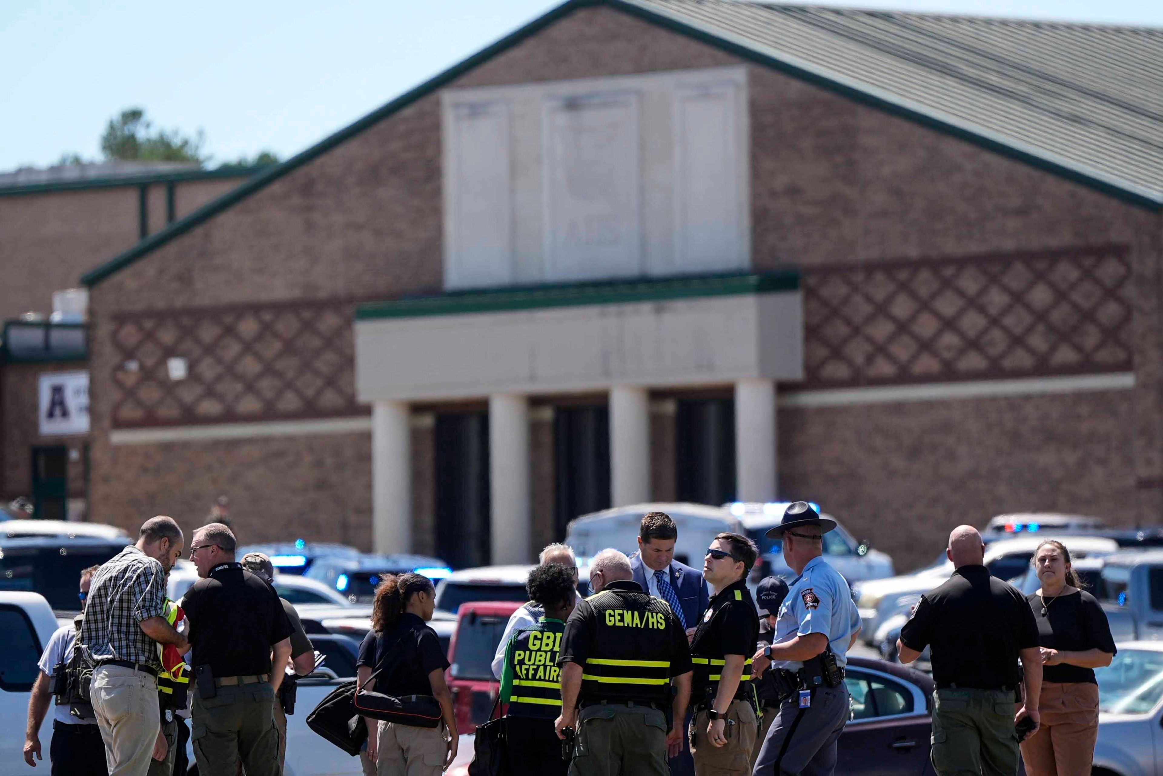 Police gather outside Apalachee High School after a shooting at the school Wednesday, Sept. 4, 2024, in Winder, Ga. (AP Photo/Mike Stewart)